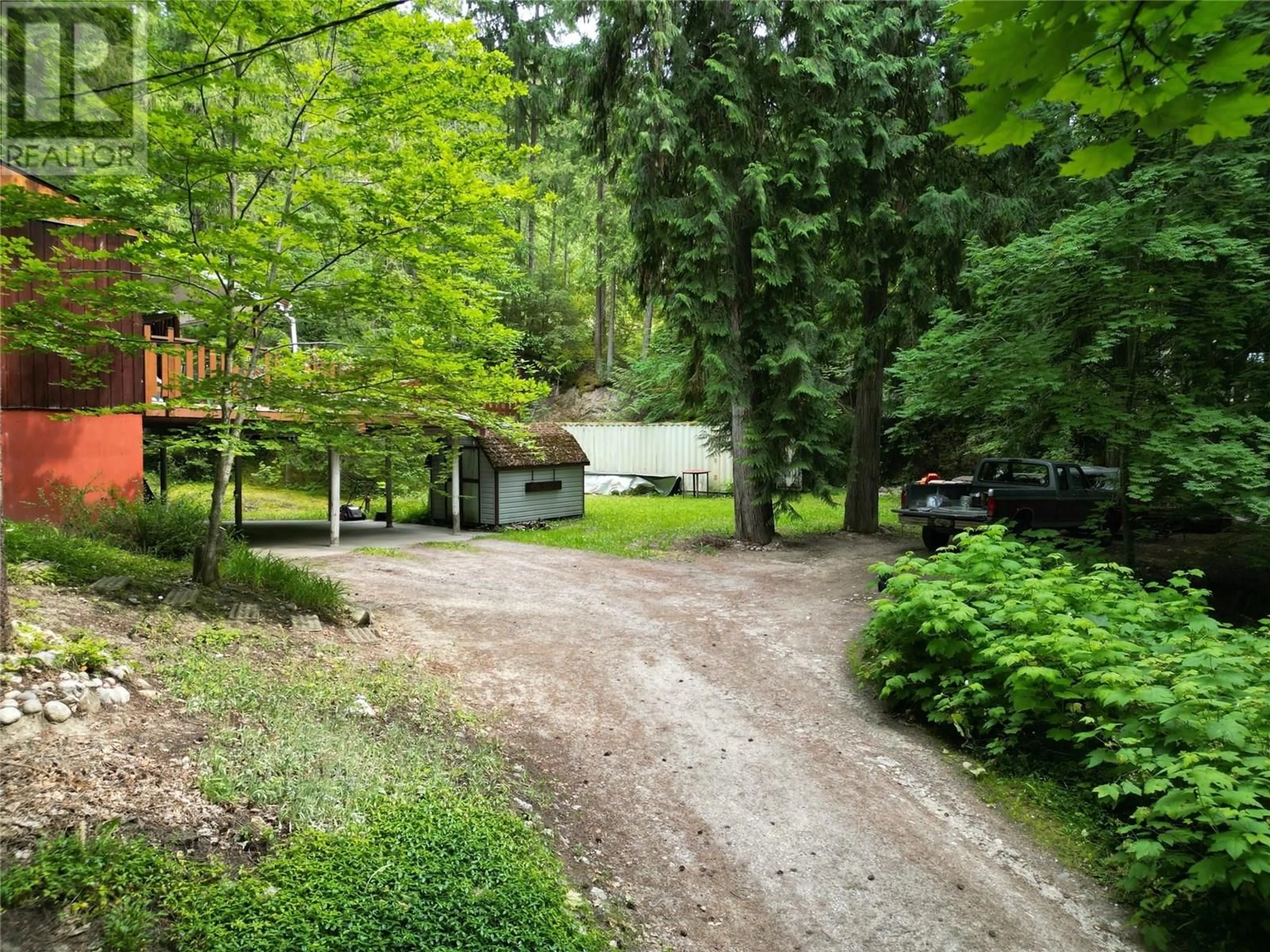 A pic from outside/outdoor area/front of a property/back of a property/a pic from drone, forest/trees view for 8043 97A HIGHWAY, Mara British Columbia V0E2K0