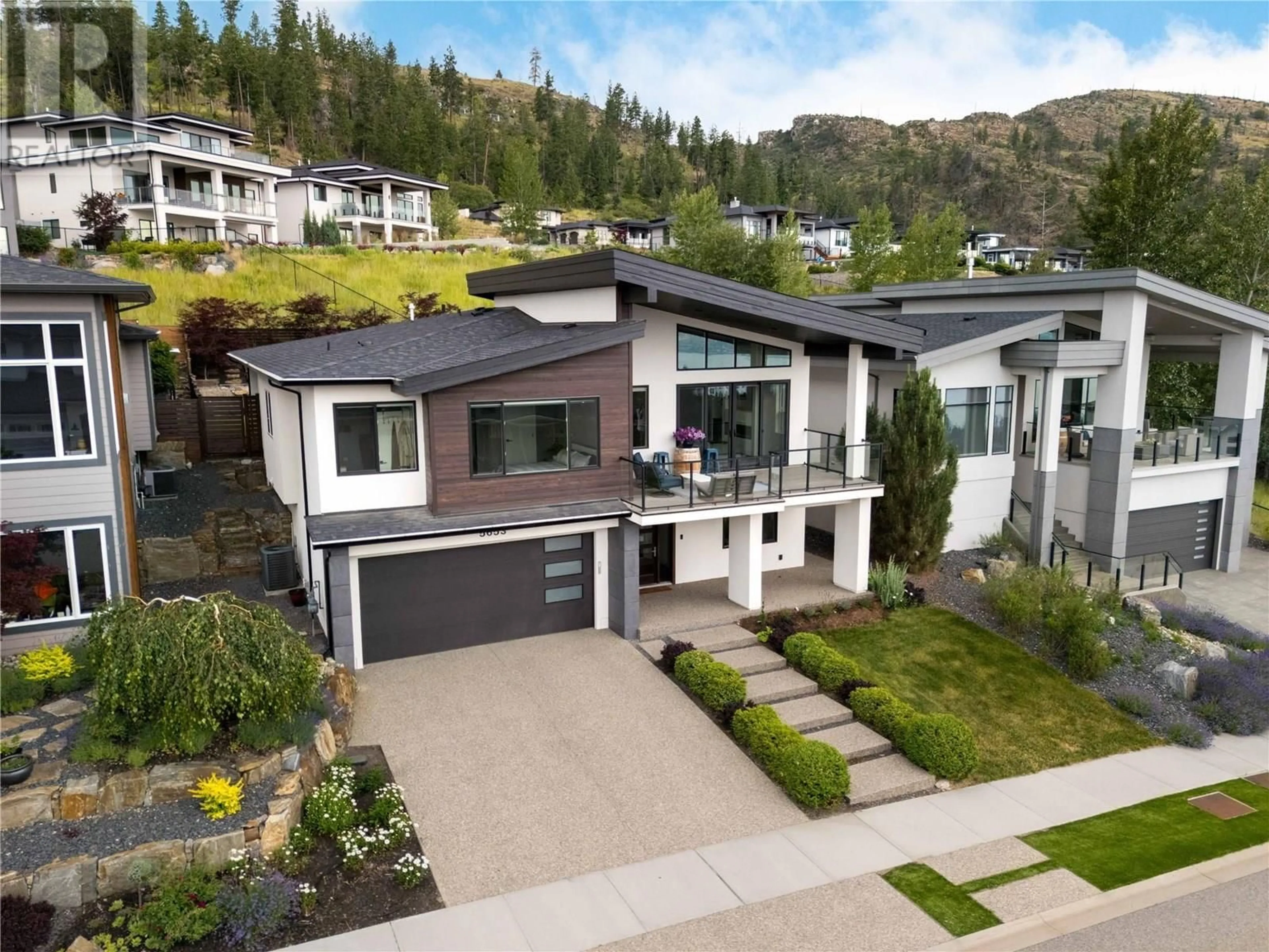 Home with vinyl exterior material, street for 5653 MOUNTAINSIDE DRIVE, Kelowna British Columbia V1W5L5