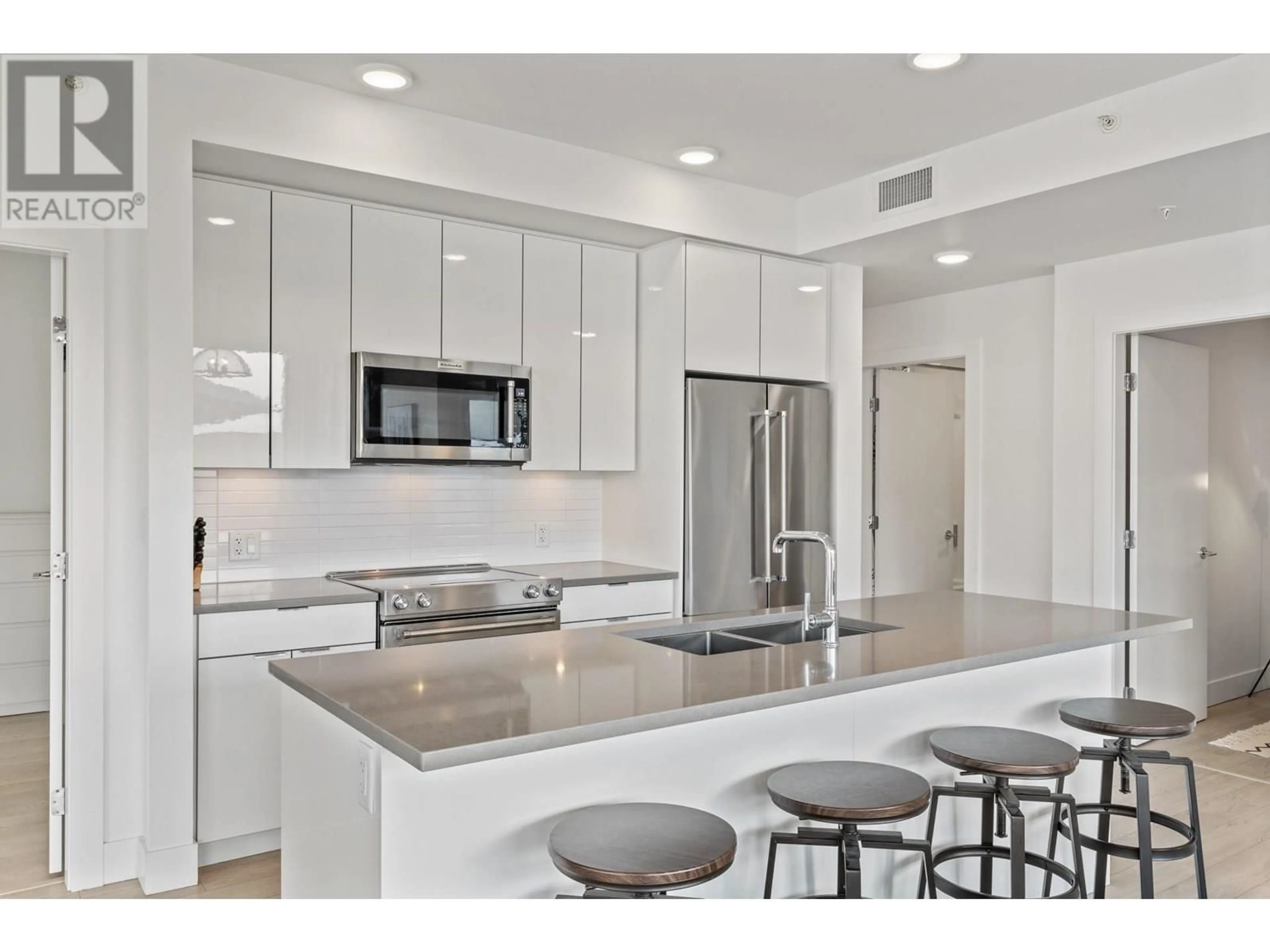 Open concept kitchen, ceramic/tile floor for 503 - 1232 ELLIS STREET, Kelowna British Columbia V1Y1Z4