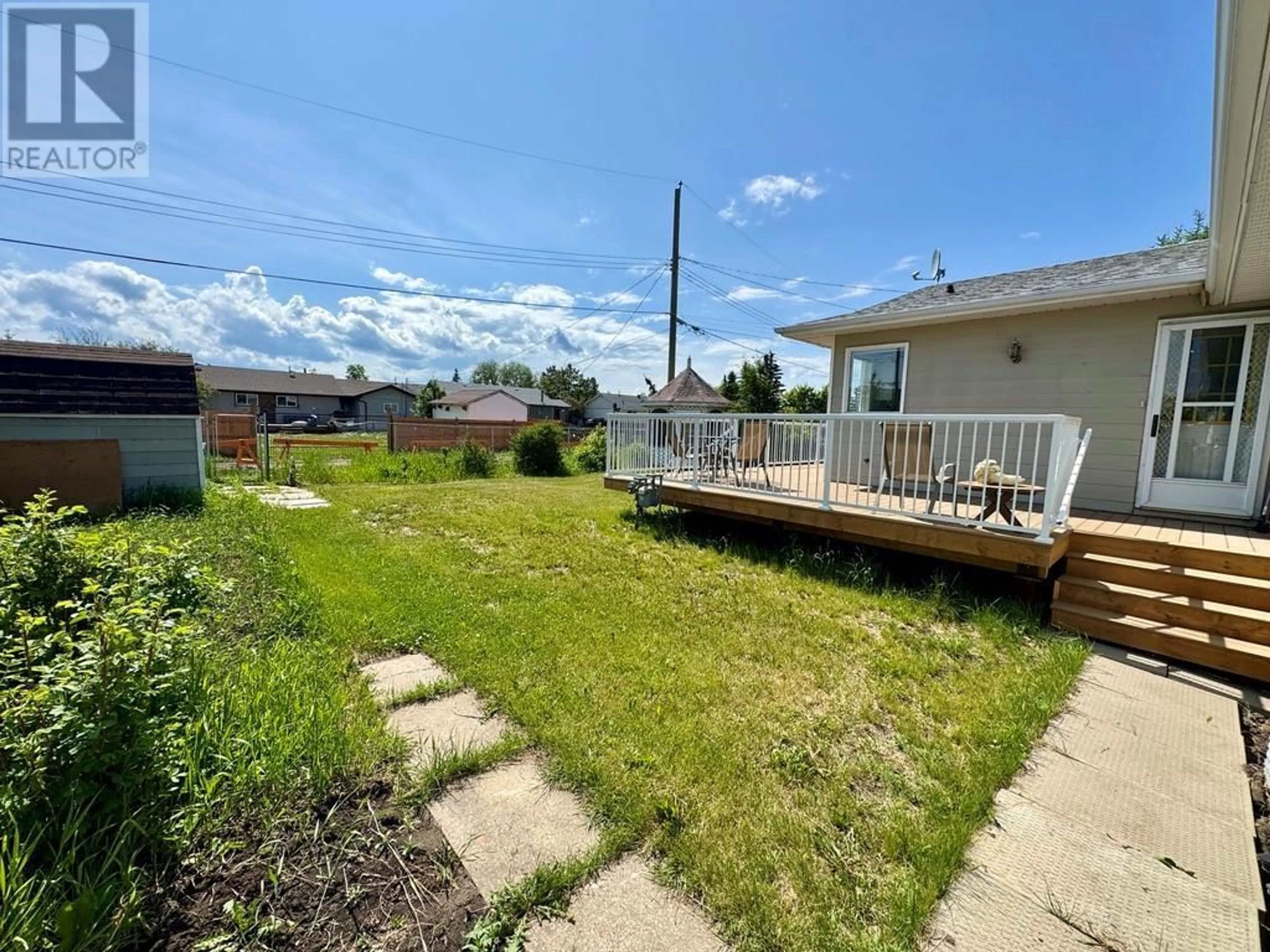 A pic from outside/outdoor area/front of a property/back of a property/a pic from drone, water/lake/river/ocean view for 1209 112 AVENUE, Dawson Creek British Columbia V1G2Y4