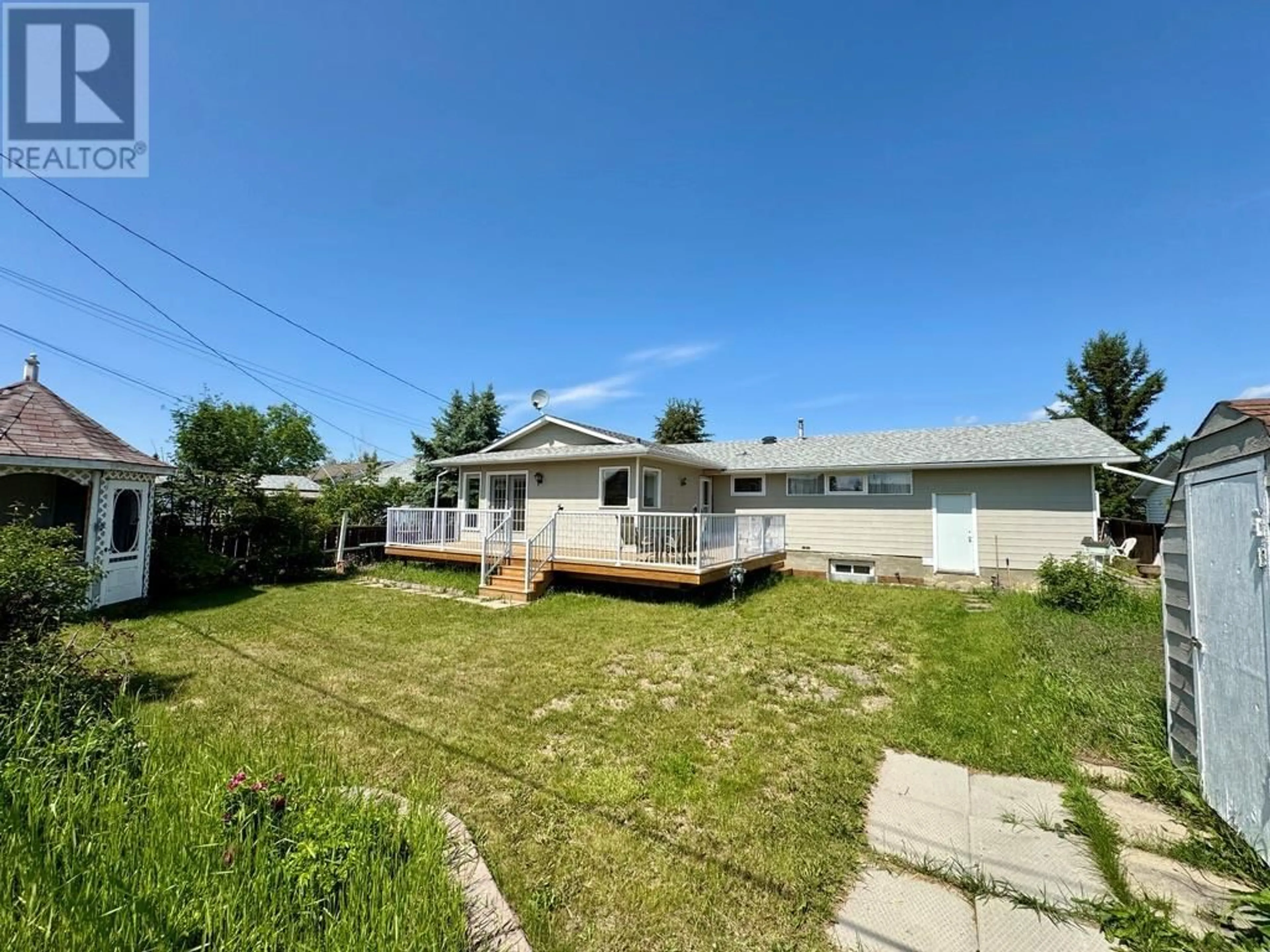 A pic from outside/outdoor area/front of a property/back of a property/a pic from drone, street for 1209 112 AVENUE, Dawson Creek British Columbia V1G2Y4