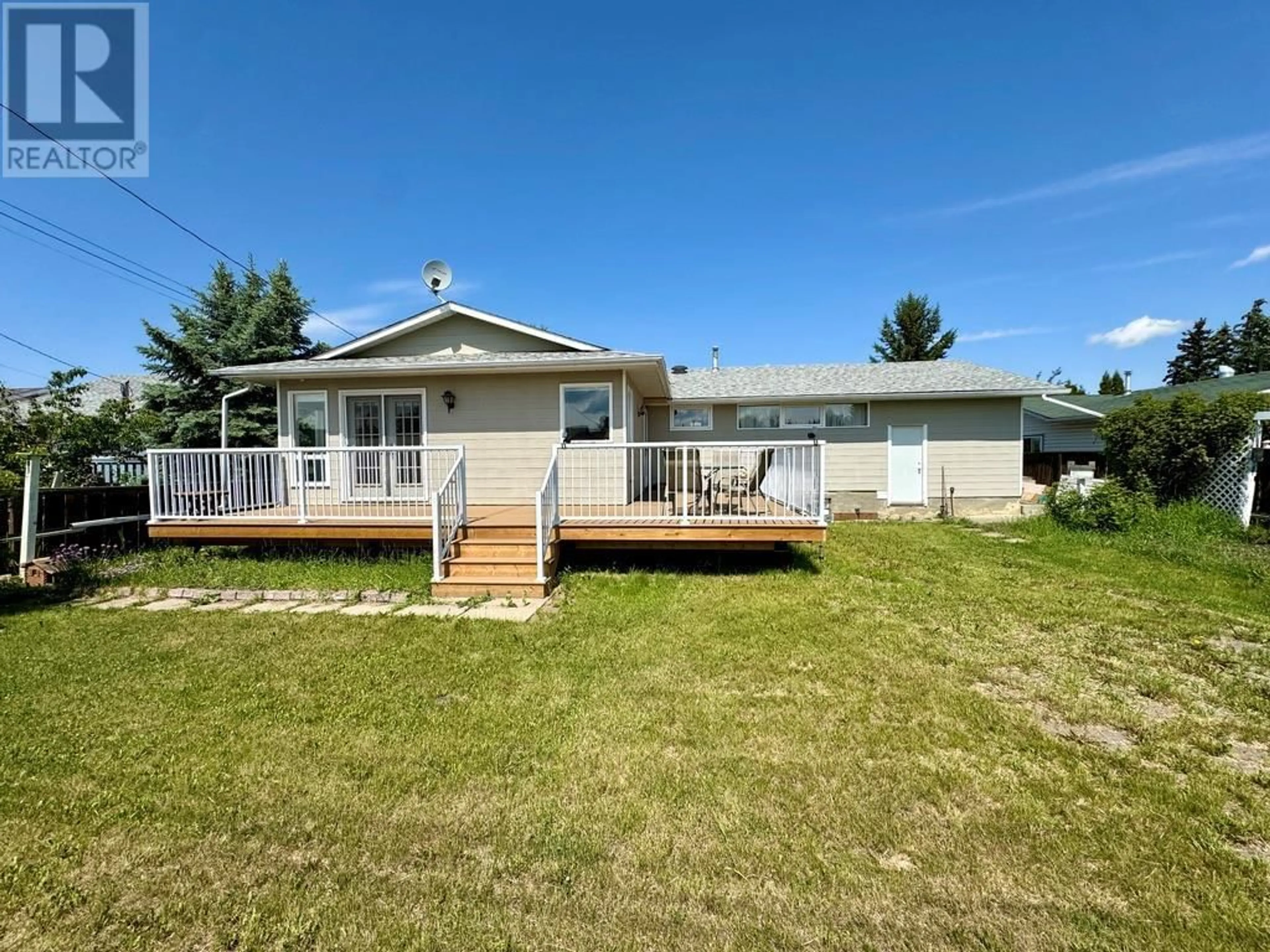 A pic from outside/outdoor area/front of a property/back of a property/a pic from drone, water/lake/river/ocean view for 1209 112 AVENUE, Dawson Creek British Columbia V1G2Y4