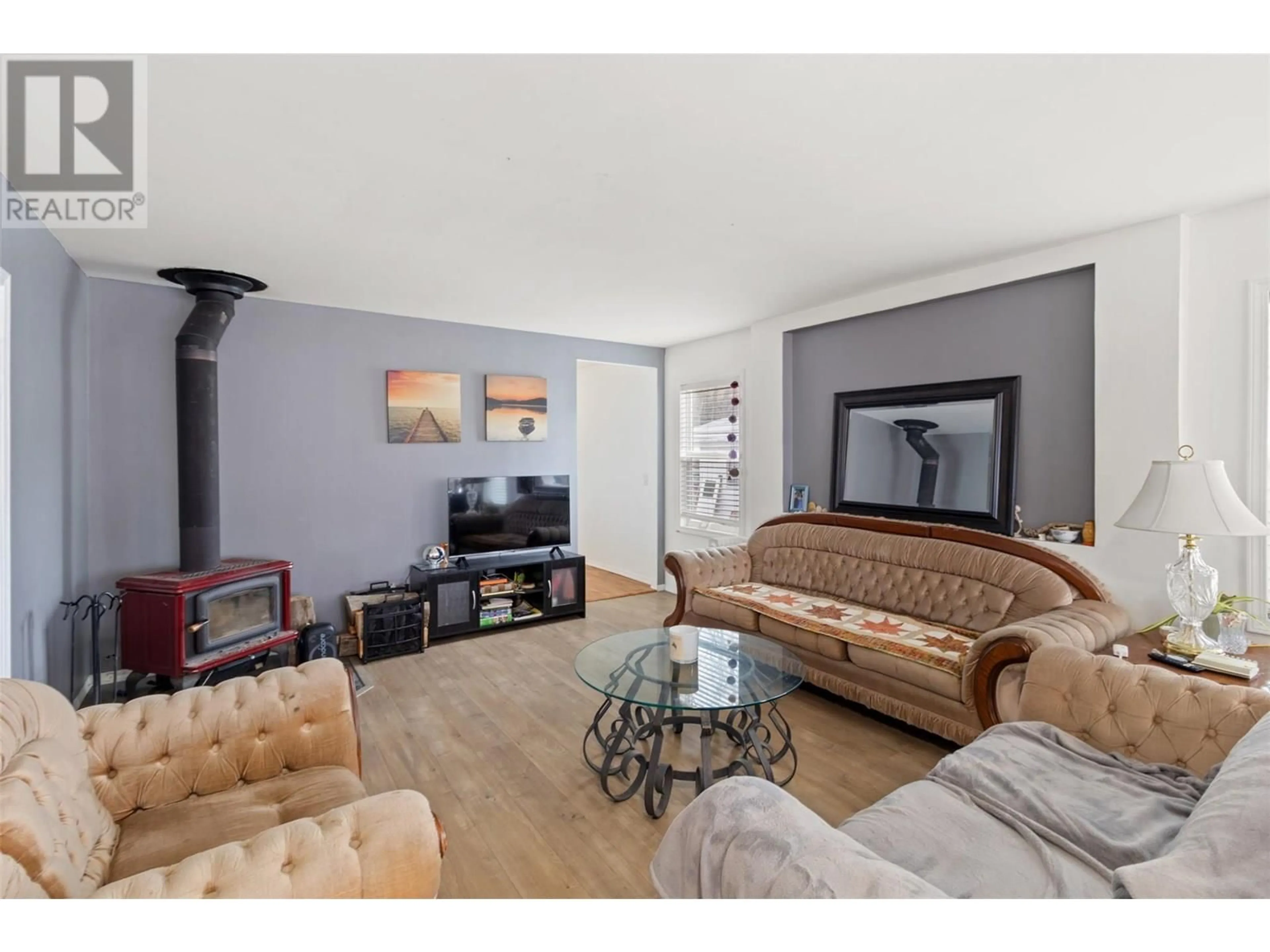 Living room with furniture, wood/laminate floor for 34 - 1680 WESTSYDE ROAD, Kamloops British Columbia V2B7B6