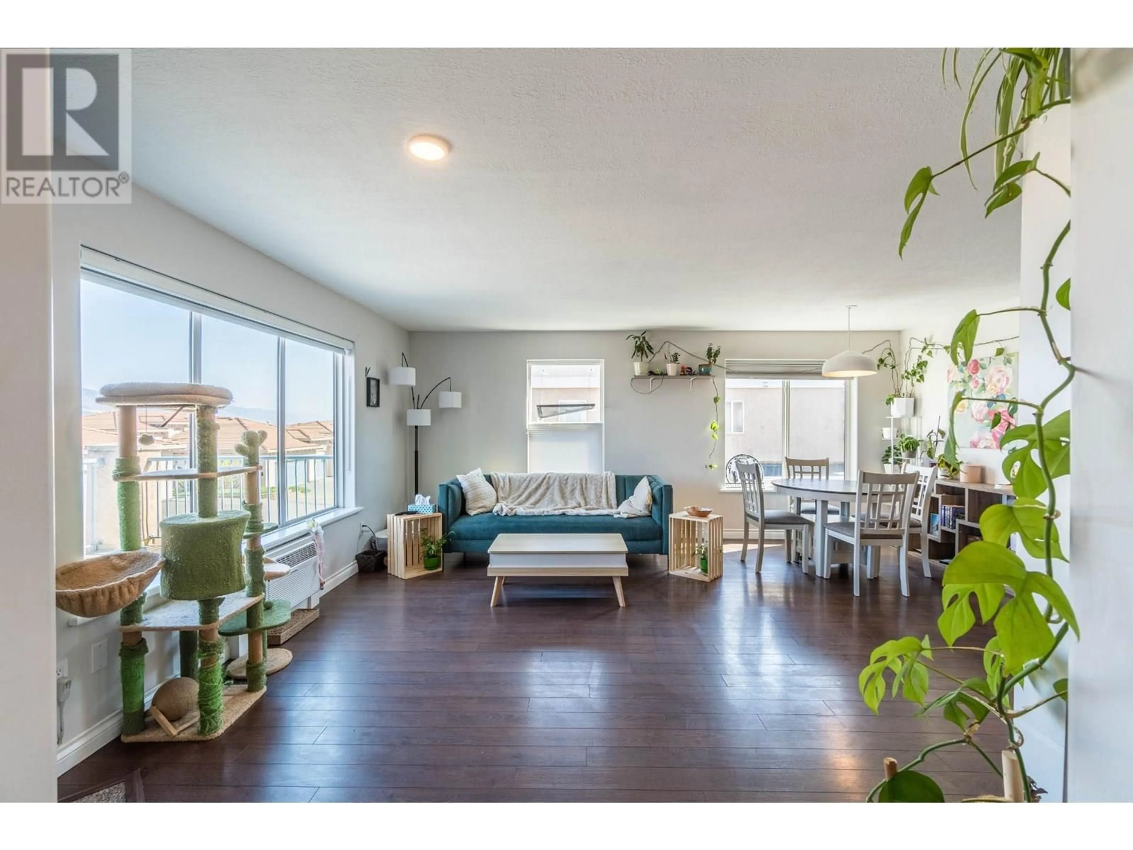 Living room with furniture, wood/laminate floor for 204 - 875 SAHALI TERRACE, Kamloops British Columbia V2C6W8