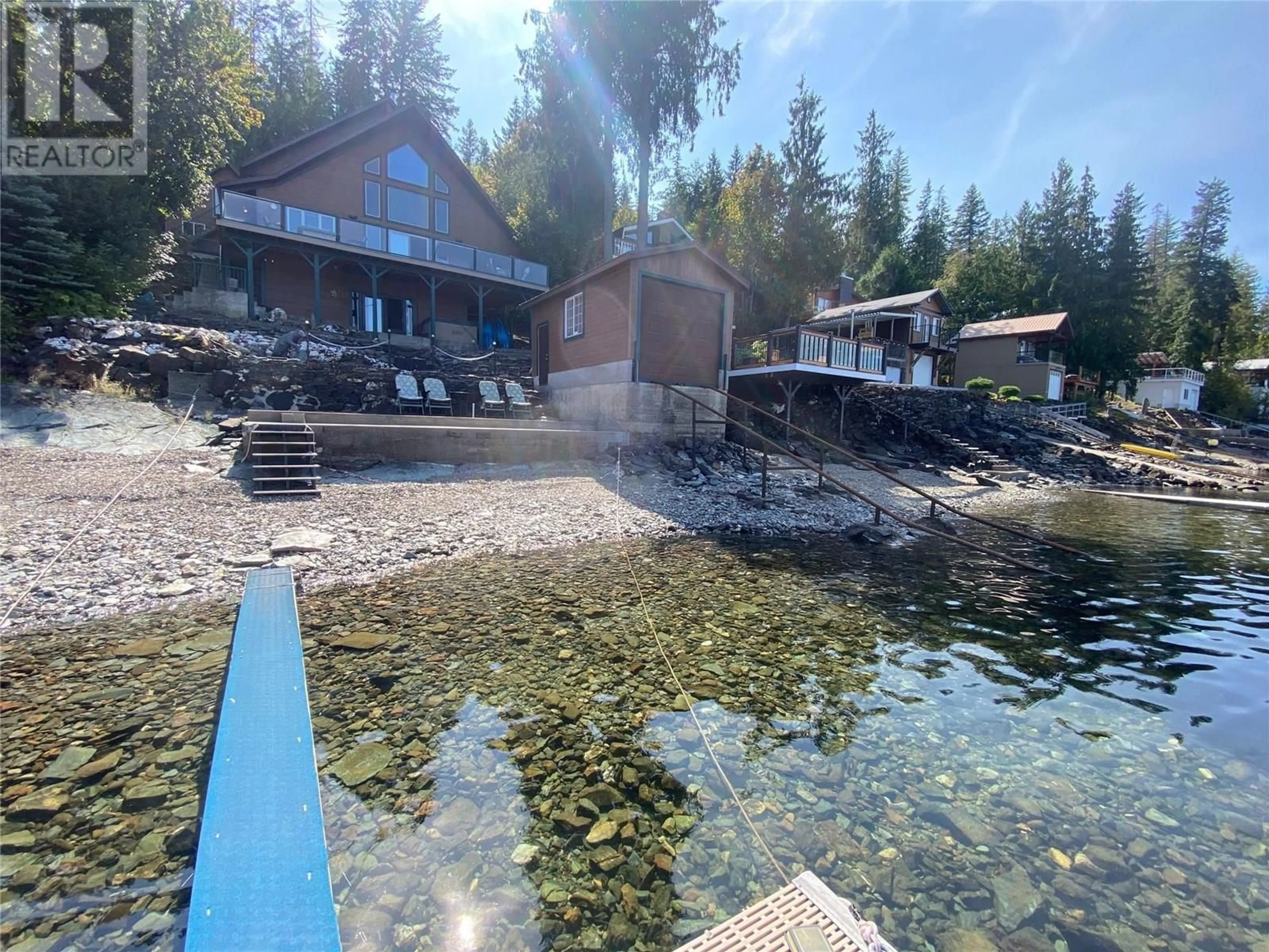 A pic from outside/outdoor area/front of a property/back of a property/a pic from drone, water/lake/river/ocean view for 4279 JUSTIN ROAD, Eagle Bay British Columbia V0E1T0