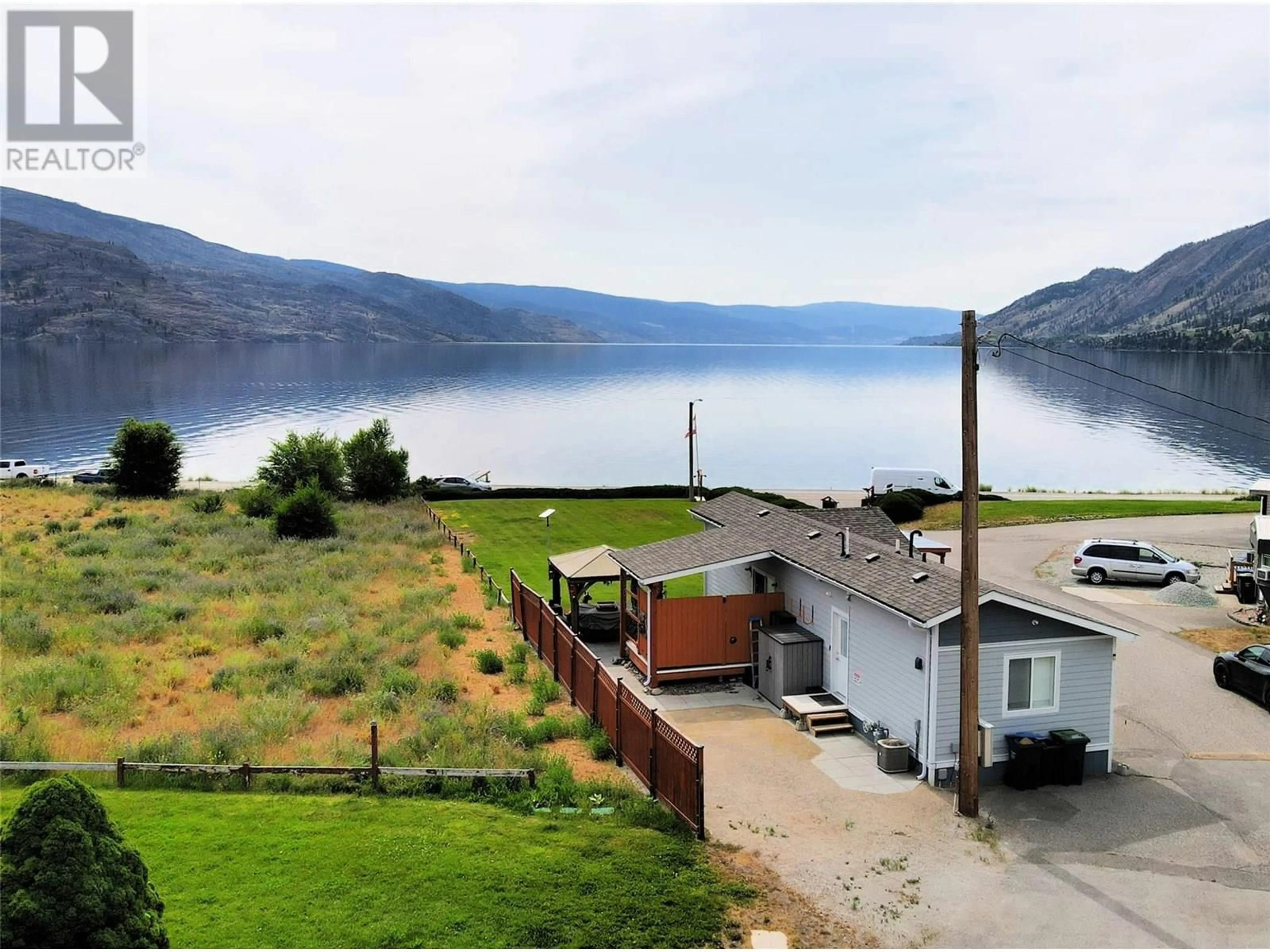 A pic from outside/outdoor area/front of a property/back of a property/a pic from drone, water/lake/river/ocean view for 16 - 6711 HWY 97S HIGHWAY, Peachland British Columbia V0H1X9