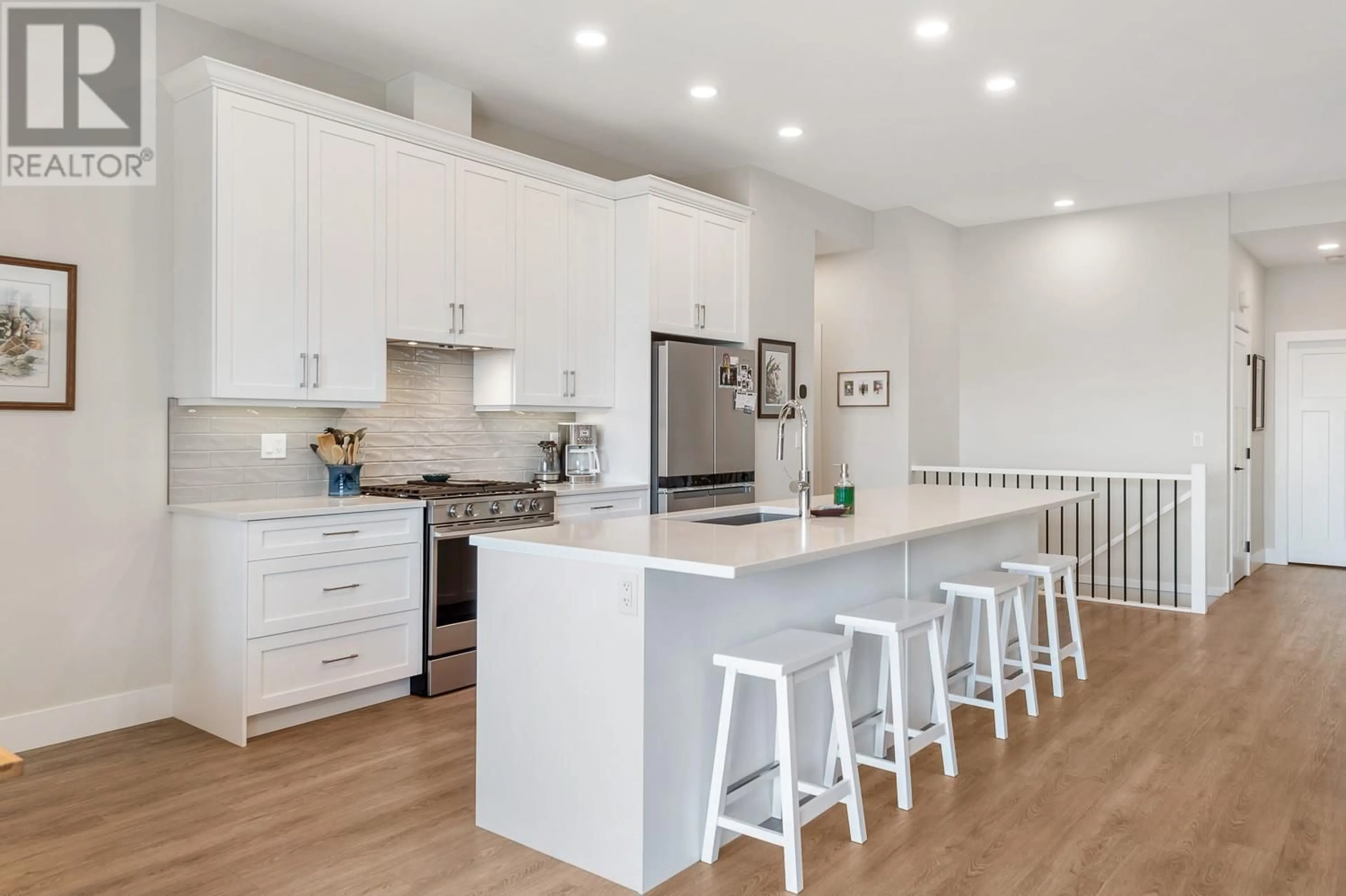 Open concept kitchen, wood/laminate floor for 2 - 496 SILVERSAGE PLACE, Vernon British Columbia V1H2J2