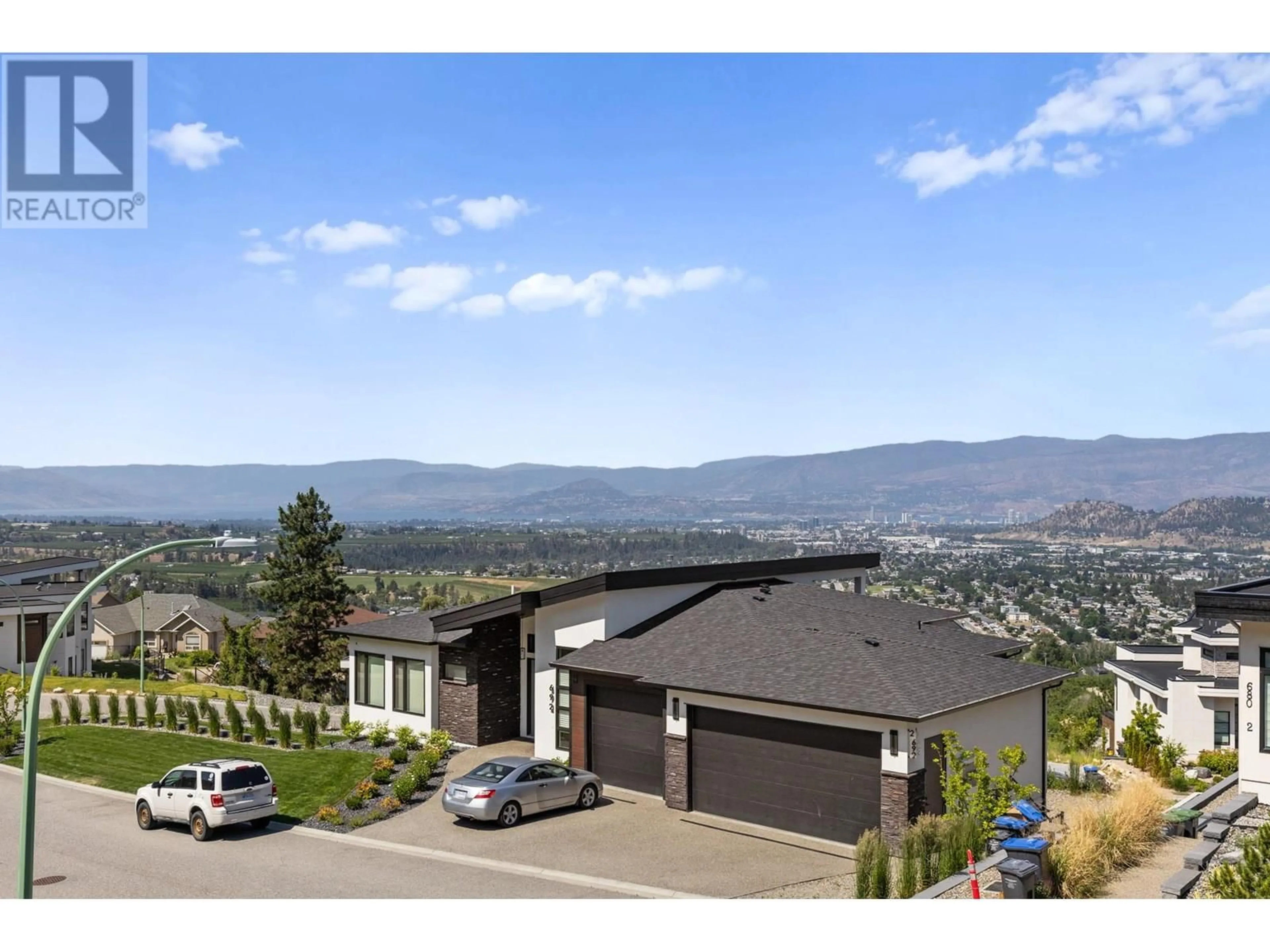 A pic from outside/outdoor area/front of a property/back of a property/a pic from drone, mountain view for 683 DEANS DRIVE, Kelowna British Columbia V1P1A1