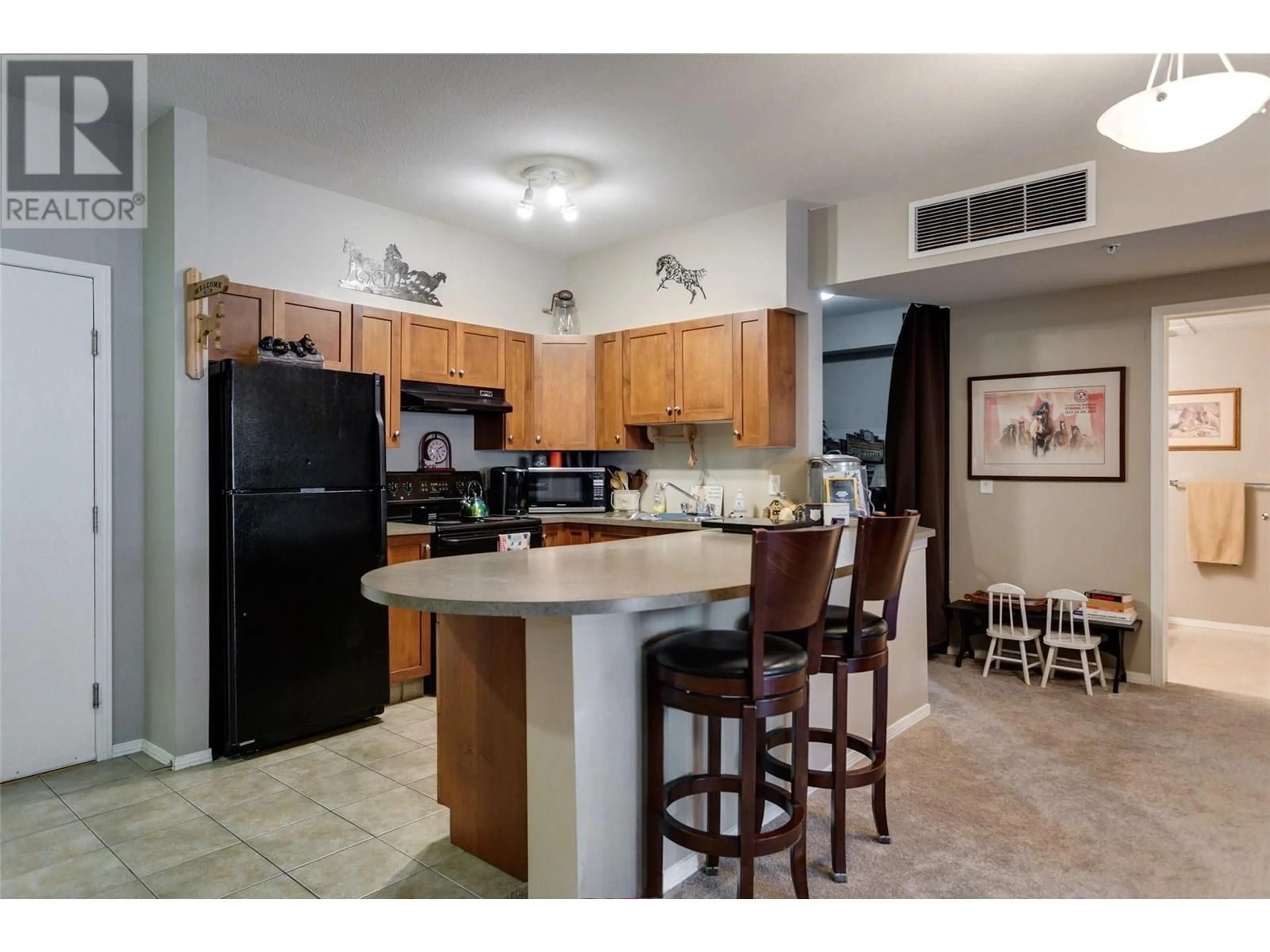 Open concept kitchen, ceramic/tile floor for 2113 - 3178 VIA CENTRALE ROAD, Kelowna British Columbia V1V2T3