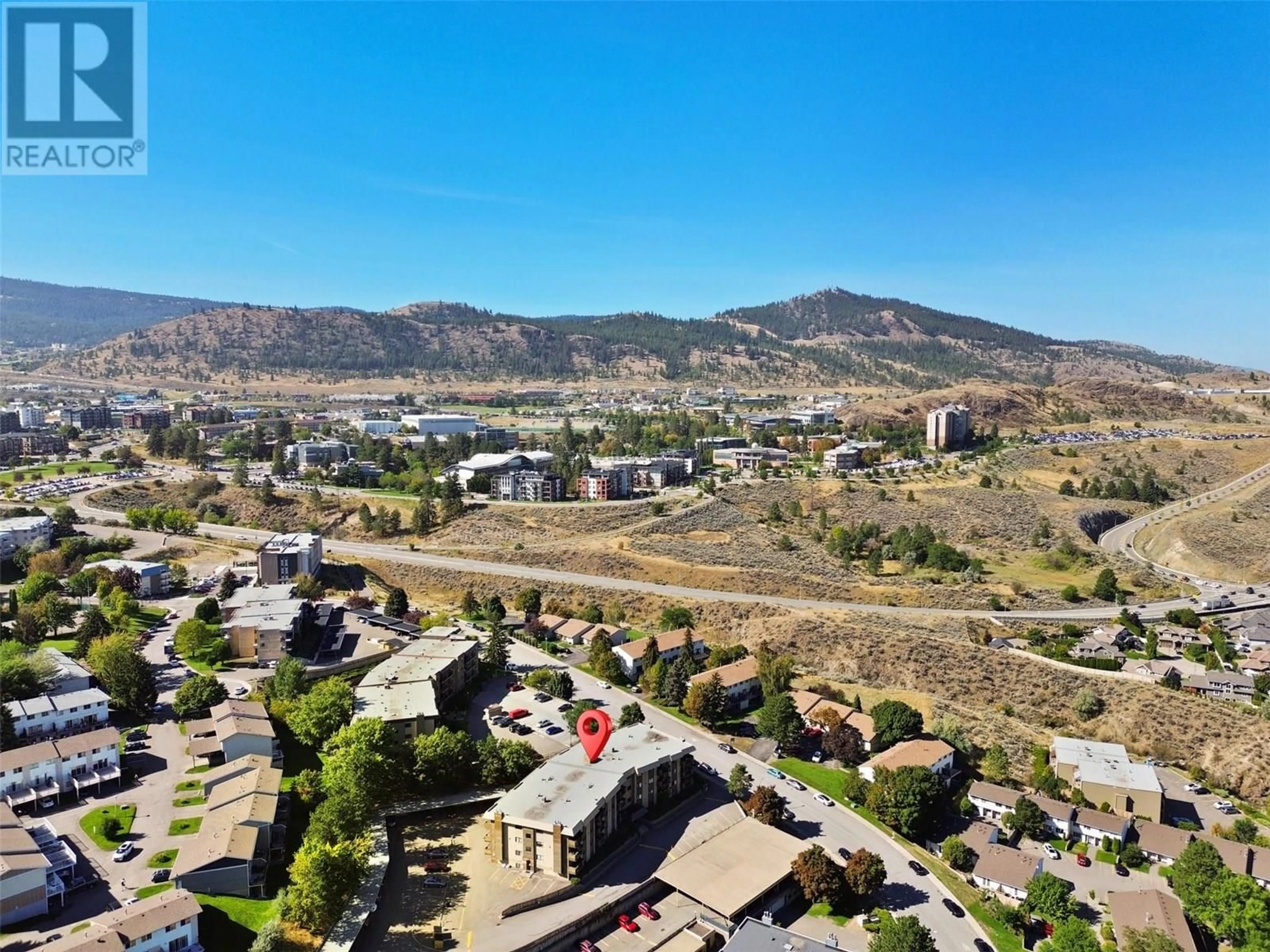A pic from outside/outdoor area/front of a property/back of a property/a pic from drone, mountain view for 202 - 555 DALGLEISH DRIVE, Kamloops British Columbia V2C6C7