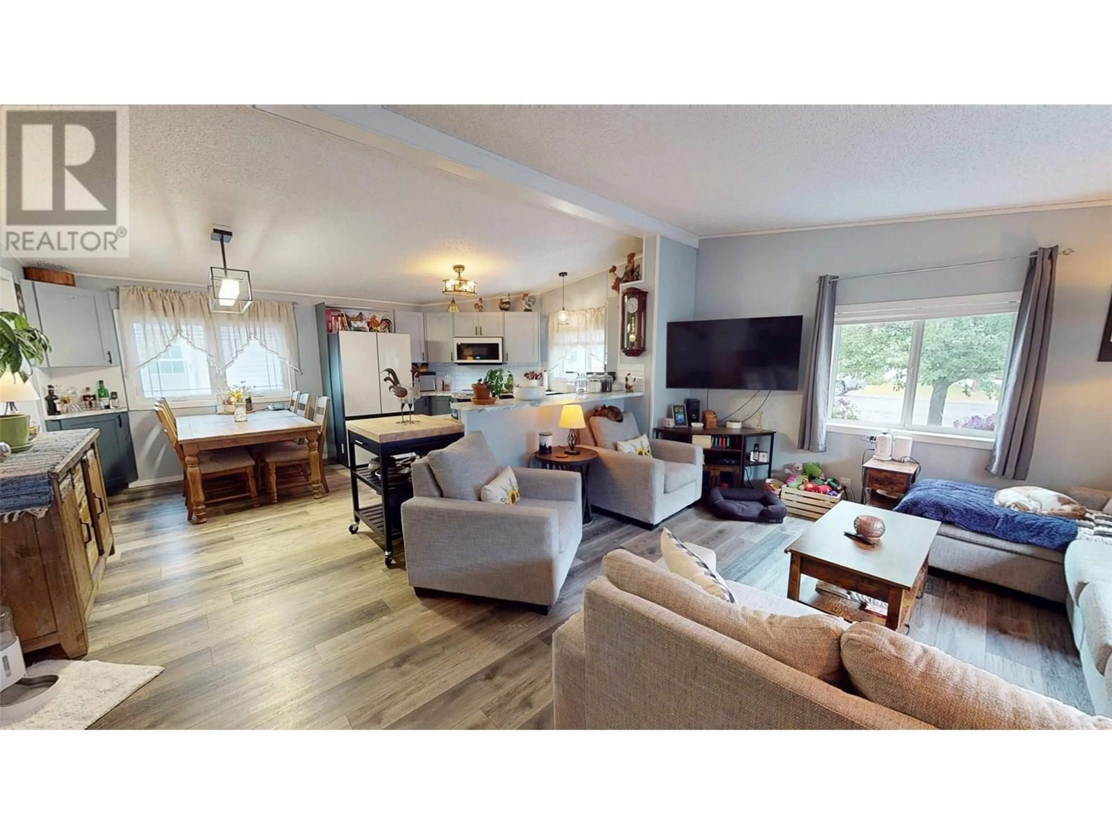 Living room with furniture, wood/laminate floor for 19 SLALOM DRIVE, Fernie British Columbia V0B1M4