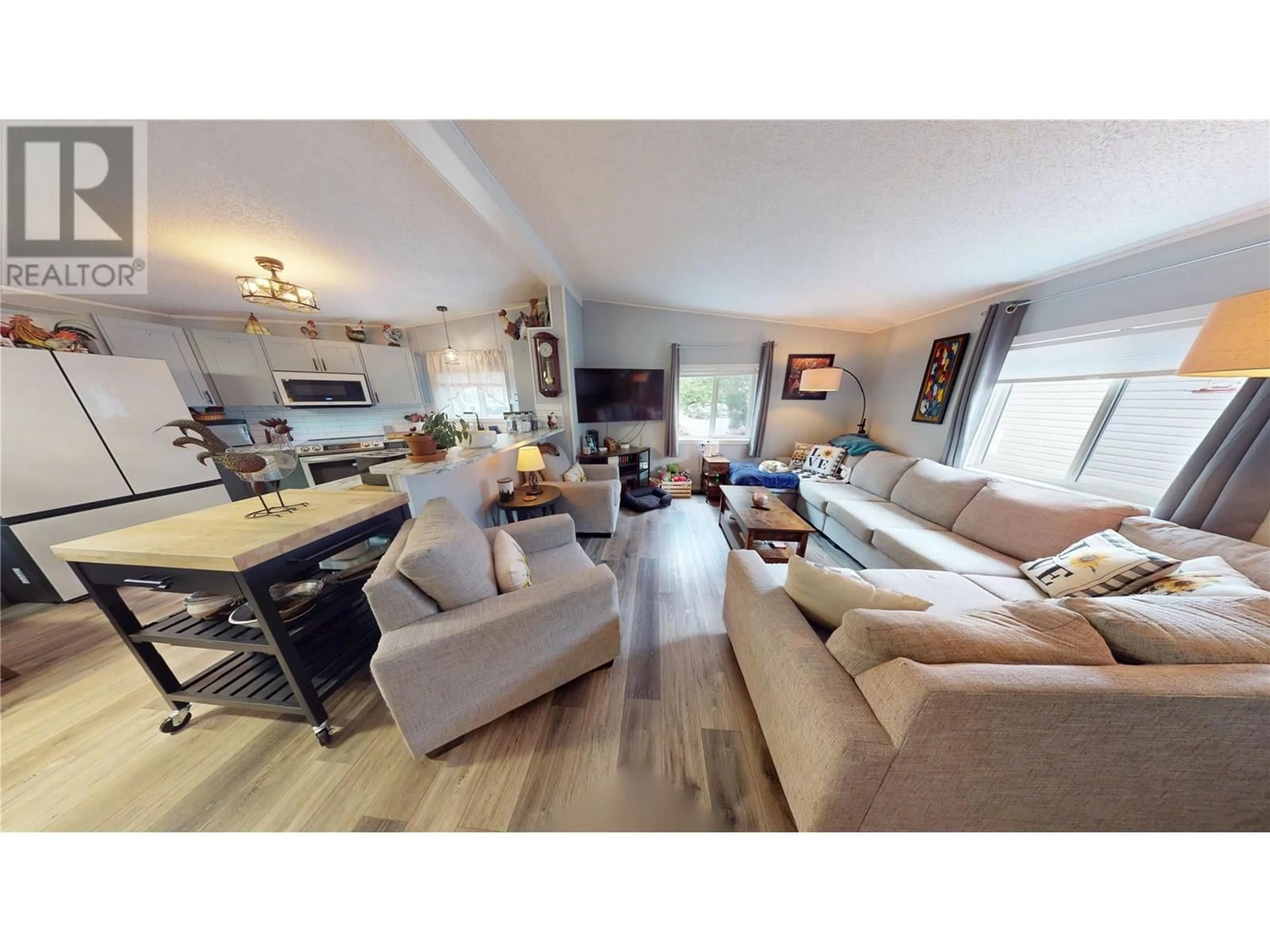 Living room with furniture, wood/laminate floor for 19 SLALOM DRIVE, Fernie British Columbia V0B1M4