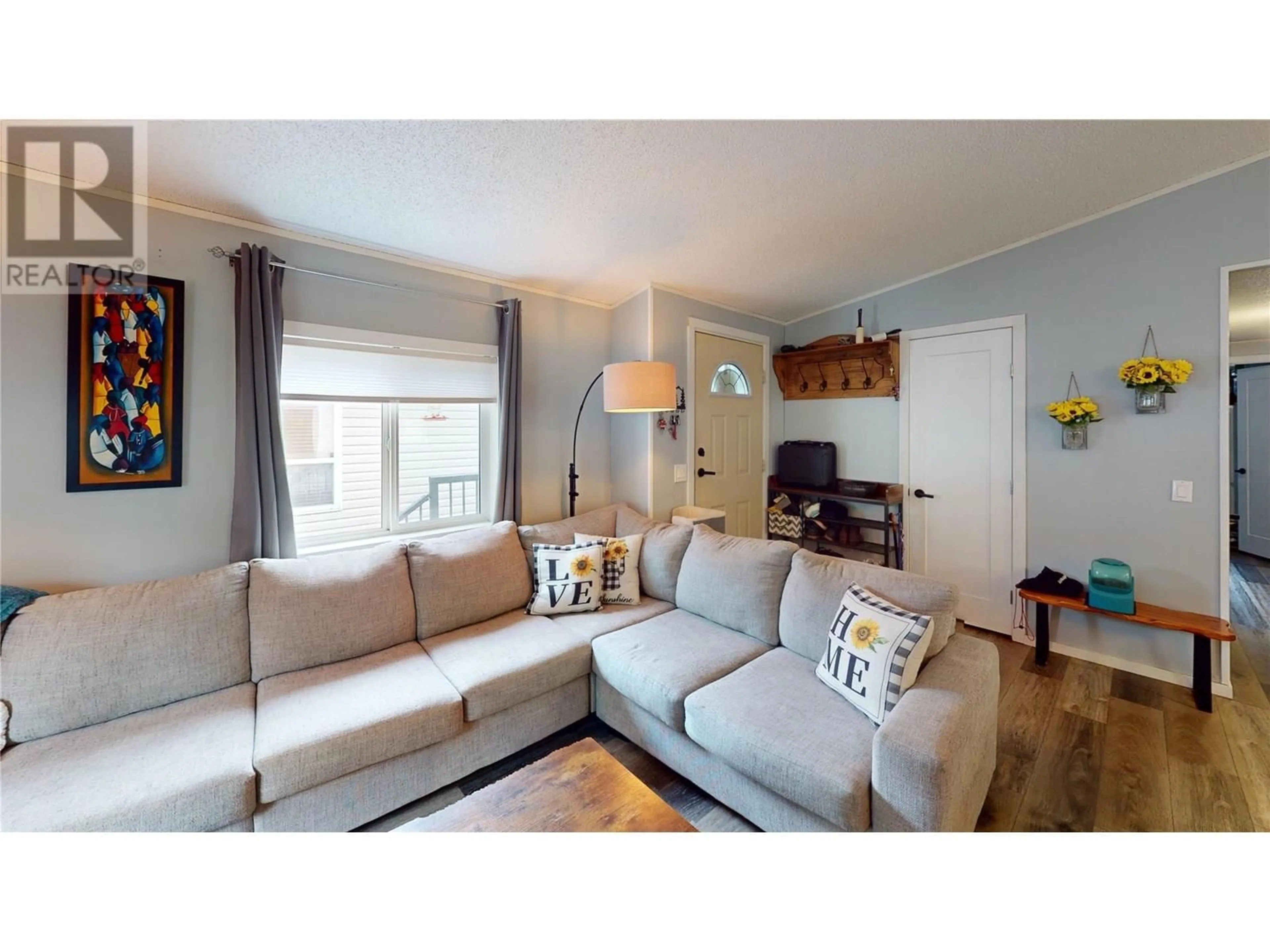 Living room with furniture, wood/laminate floor for 19 SLALOM DRIVE, Fernie British Columbia V0B1M4