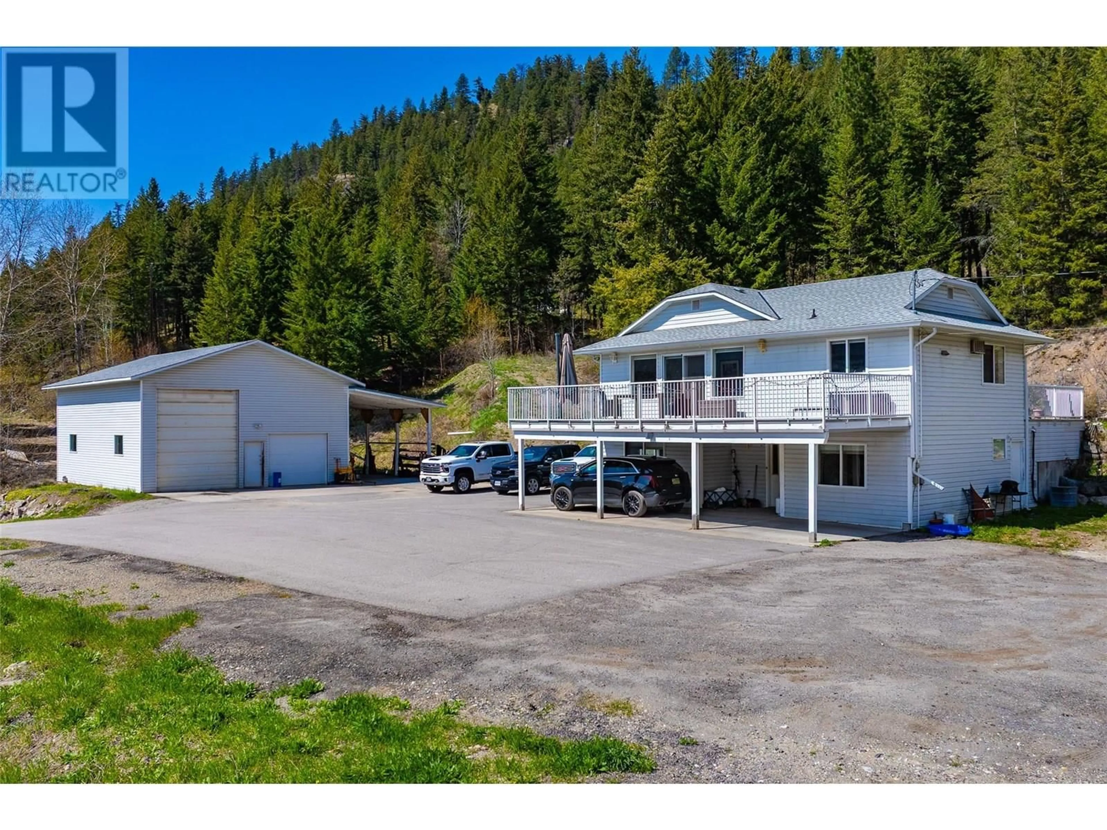 A pic from outside/outdoor area/front of a property/back of a property/a pic from drone, mountain view for 7114 GOSHAWK ROAD, Kelowna British Columbia V1P1H9