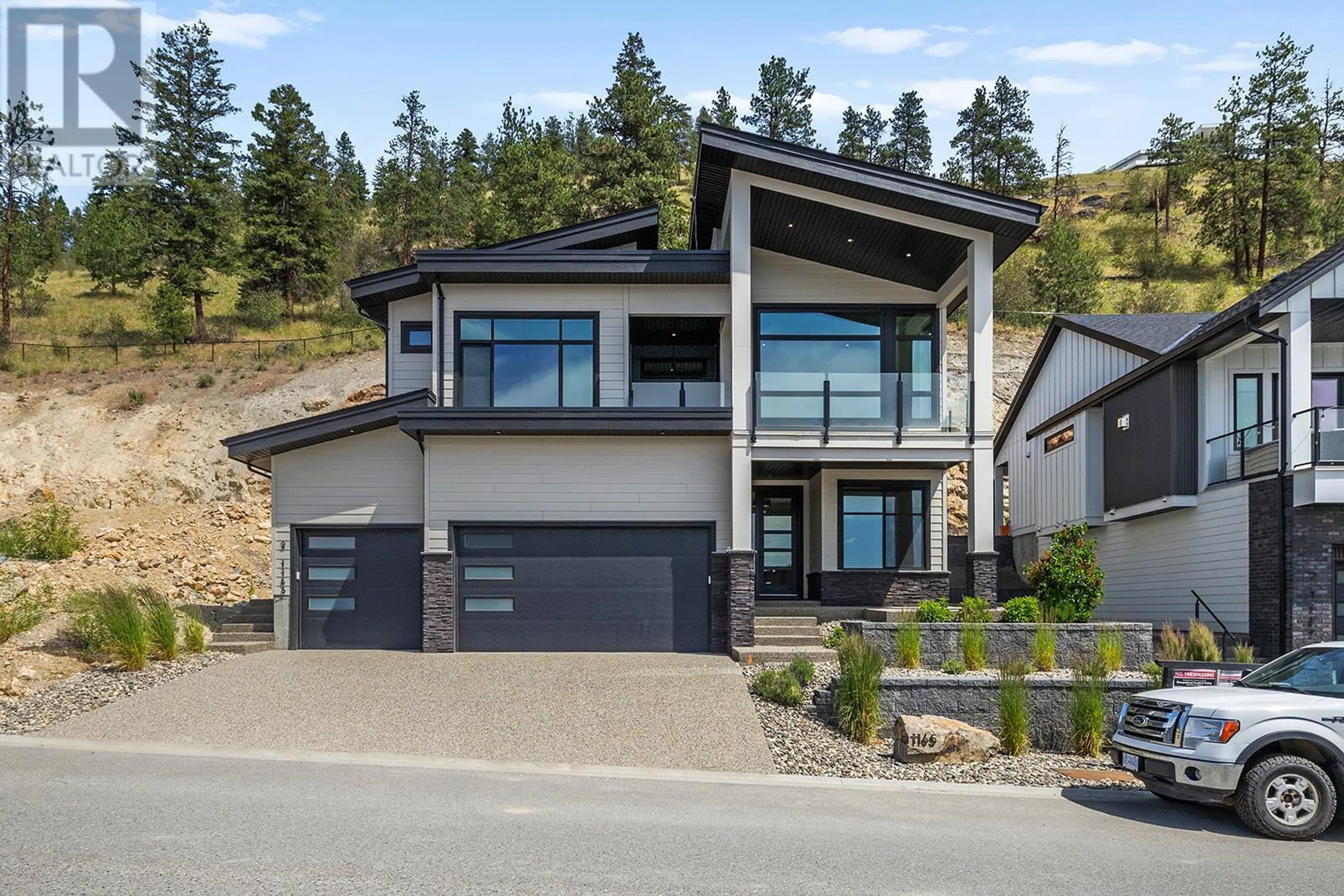 Home with vinyl exterior material, mountain view for 1165 LONE PINE DRIVE, Kelowna British Columbia V1P0A5