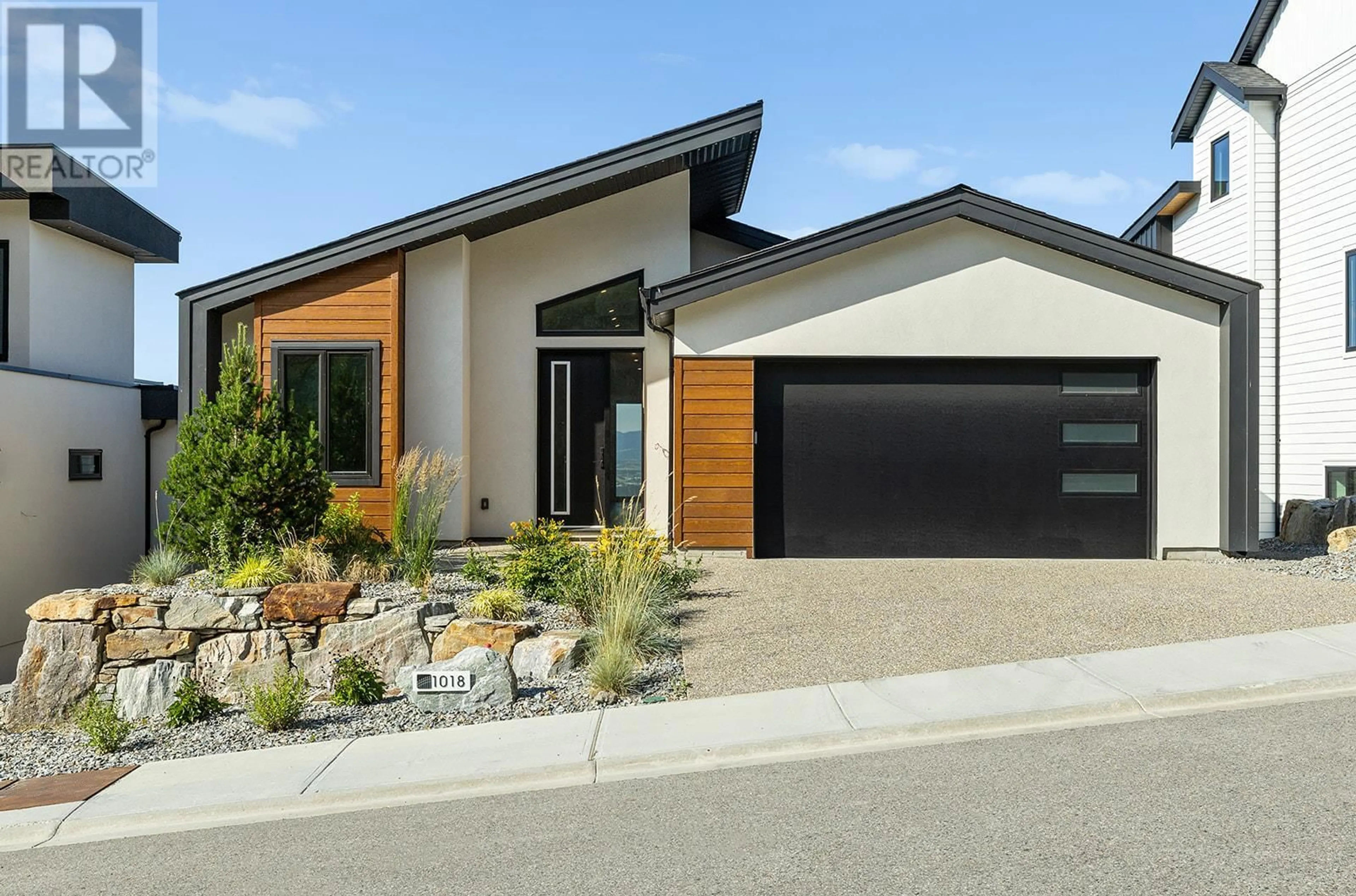 Home with brick exterior material, street for 1018 EMSLIE STREET, Kelowna British Columbia V1W5J1