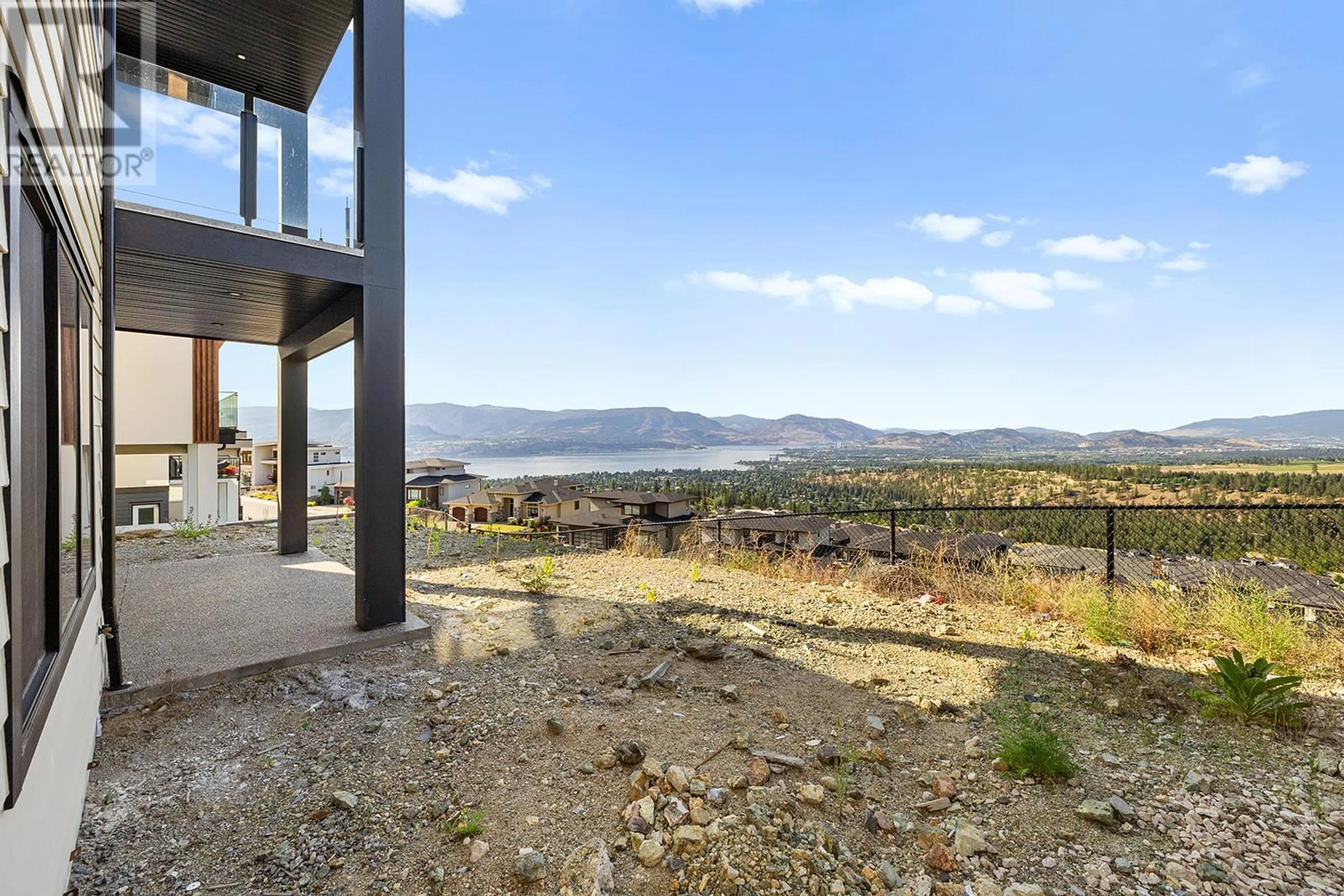 A pic from outside/outdoor area/front of a property/back of a property/a pic from drone, water/lake/river/ocean view for 1018 EMSLIE STREET, Kelowna British Columbia V1W5J1