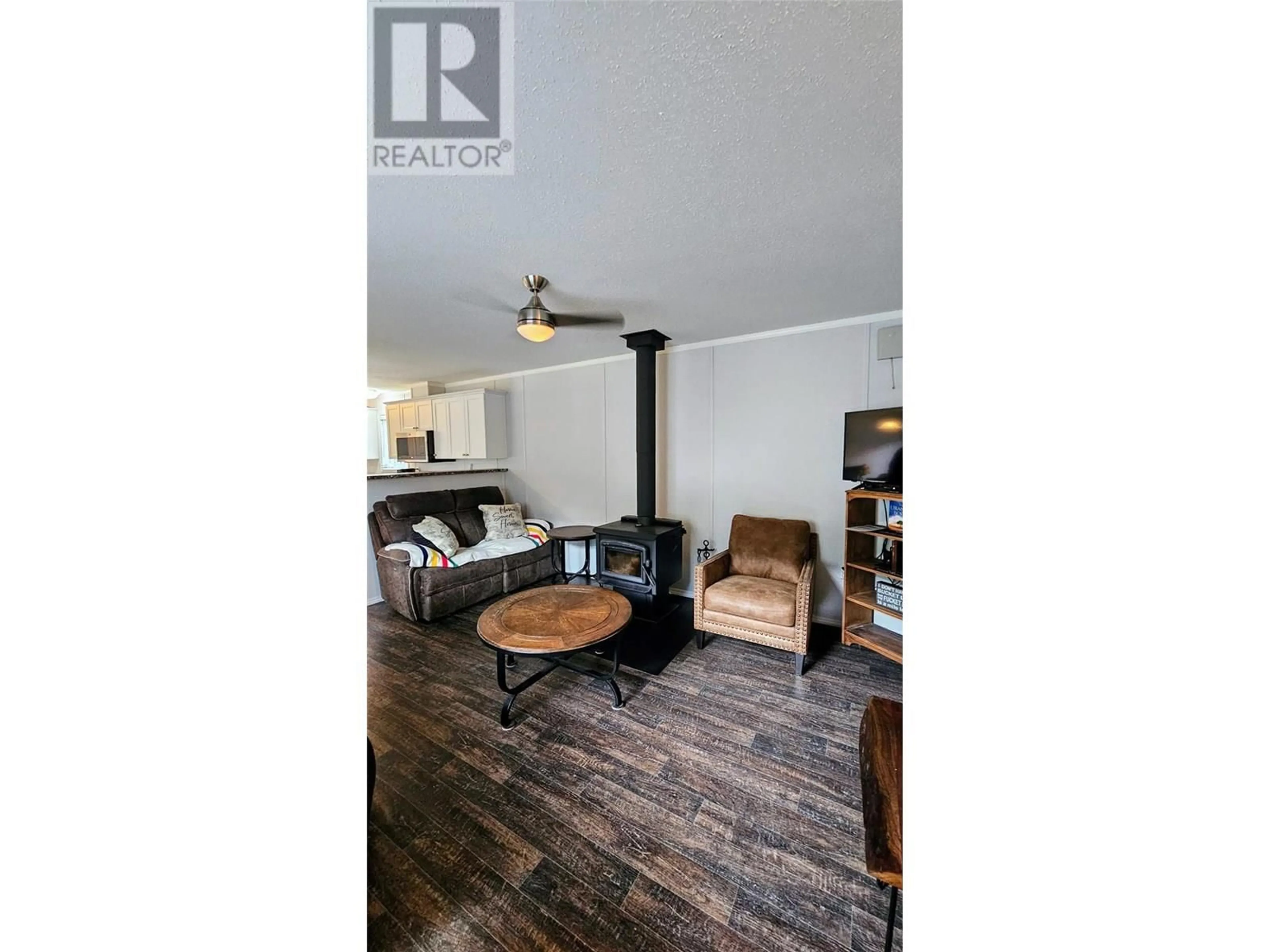 Living room with furniture, wood/laminate floor for 219 BELMOND ROAD, Salmo British Columbia V0G1Z0