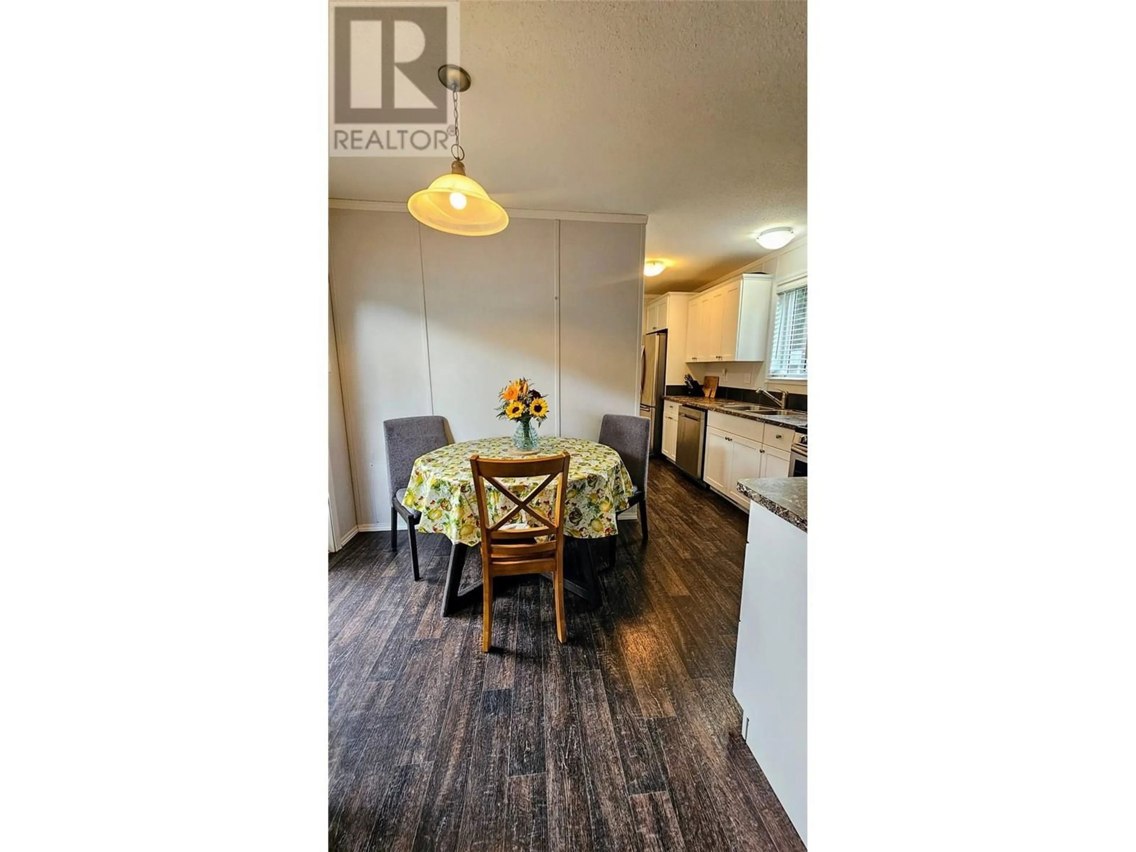 Open concept kitchen, wood/laminate floor for 219 BELMOND ROAD, Salmo British Columbia V0G1Z0