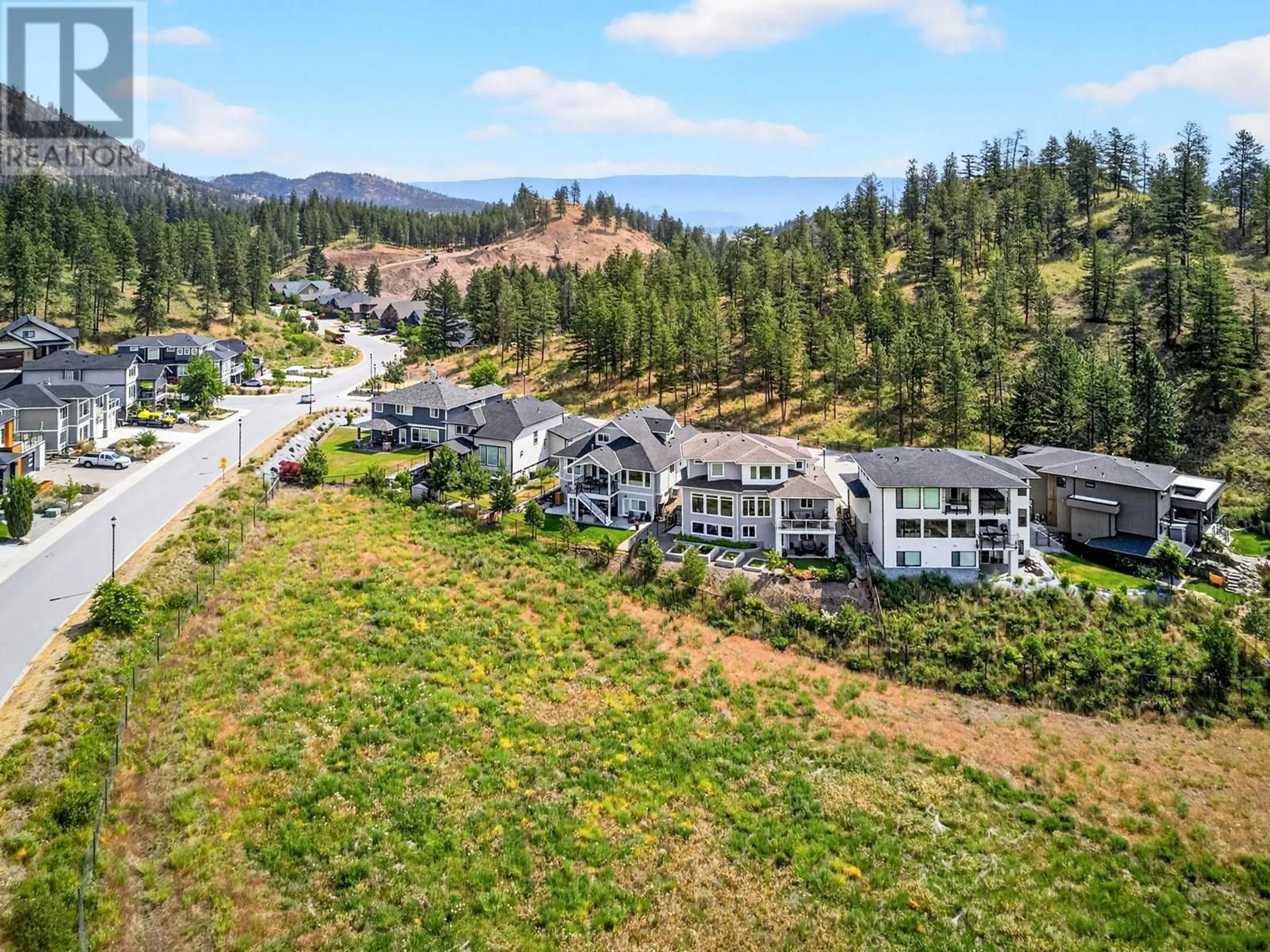 A pic from outside/outdoor area/front of a property/back of a property/a pic from drone, mountain view for 2578 CROWN CREST PLACE, West Kelowna British Columbia V4T3M6
