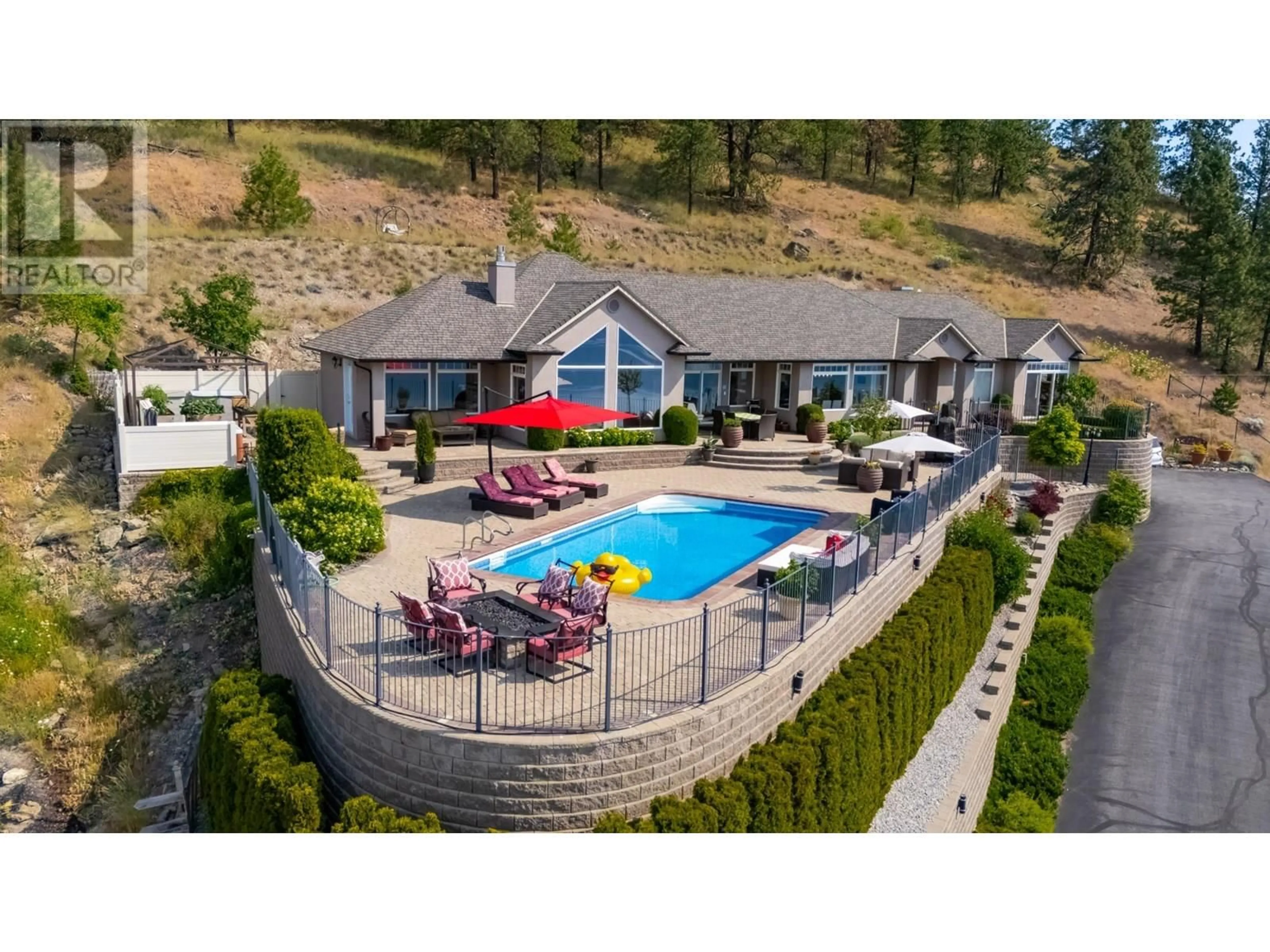 A pic from outside/outdoor area/front of a property/back of a property/a pic from drone, unknown for 1260 TIMOTHY PLACE, Kelowna British Columbia V1Z3N2