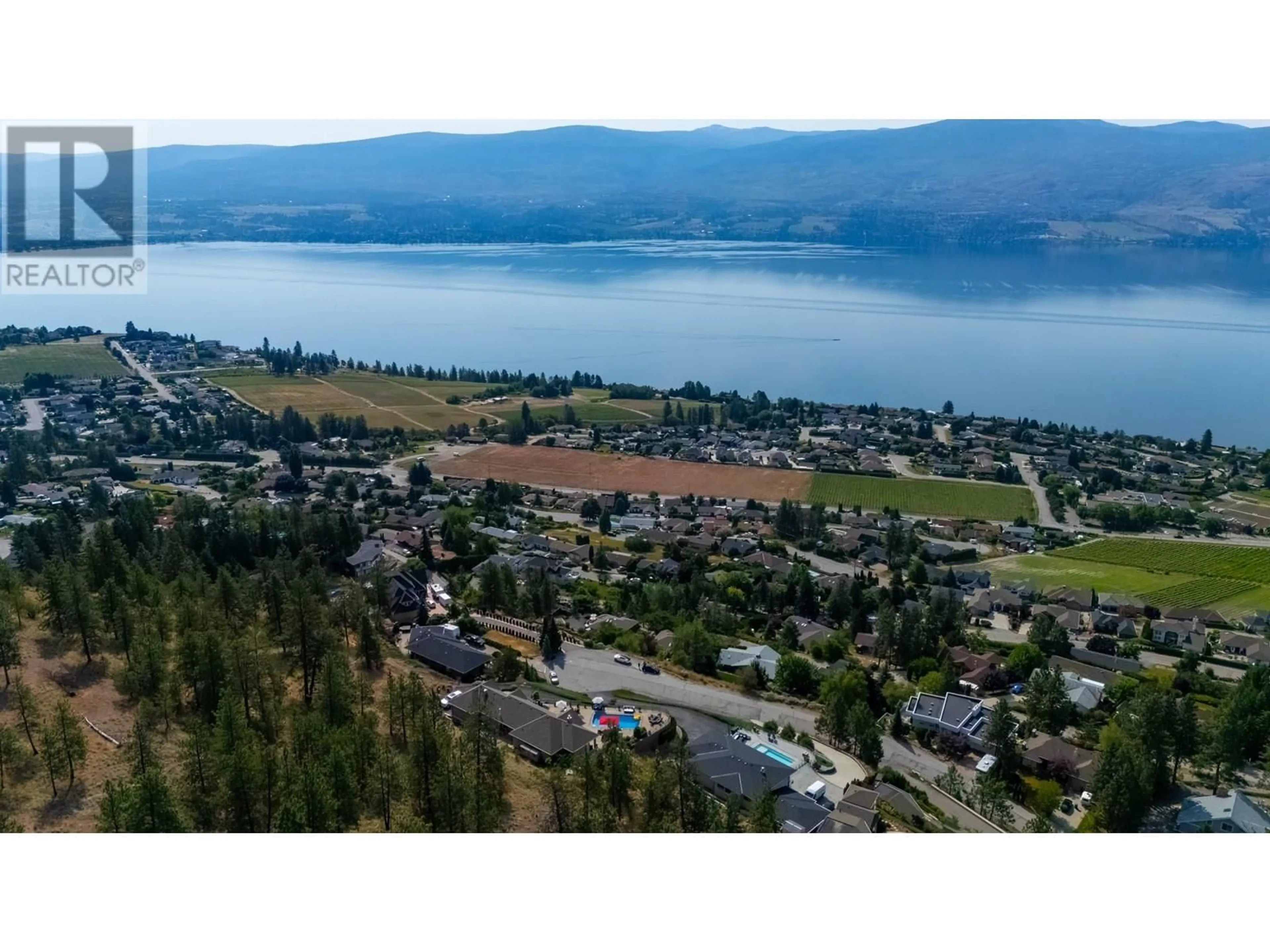 A pic from outside/outdoor area/front of a property/back of a property/a pic from drone, water/lake/river/ocean view for 1260 TIMOTHY PLACE, Kelowna British Columbia V1Z3N2