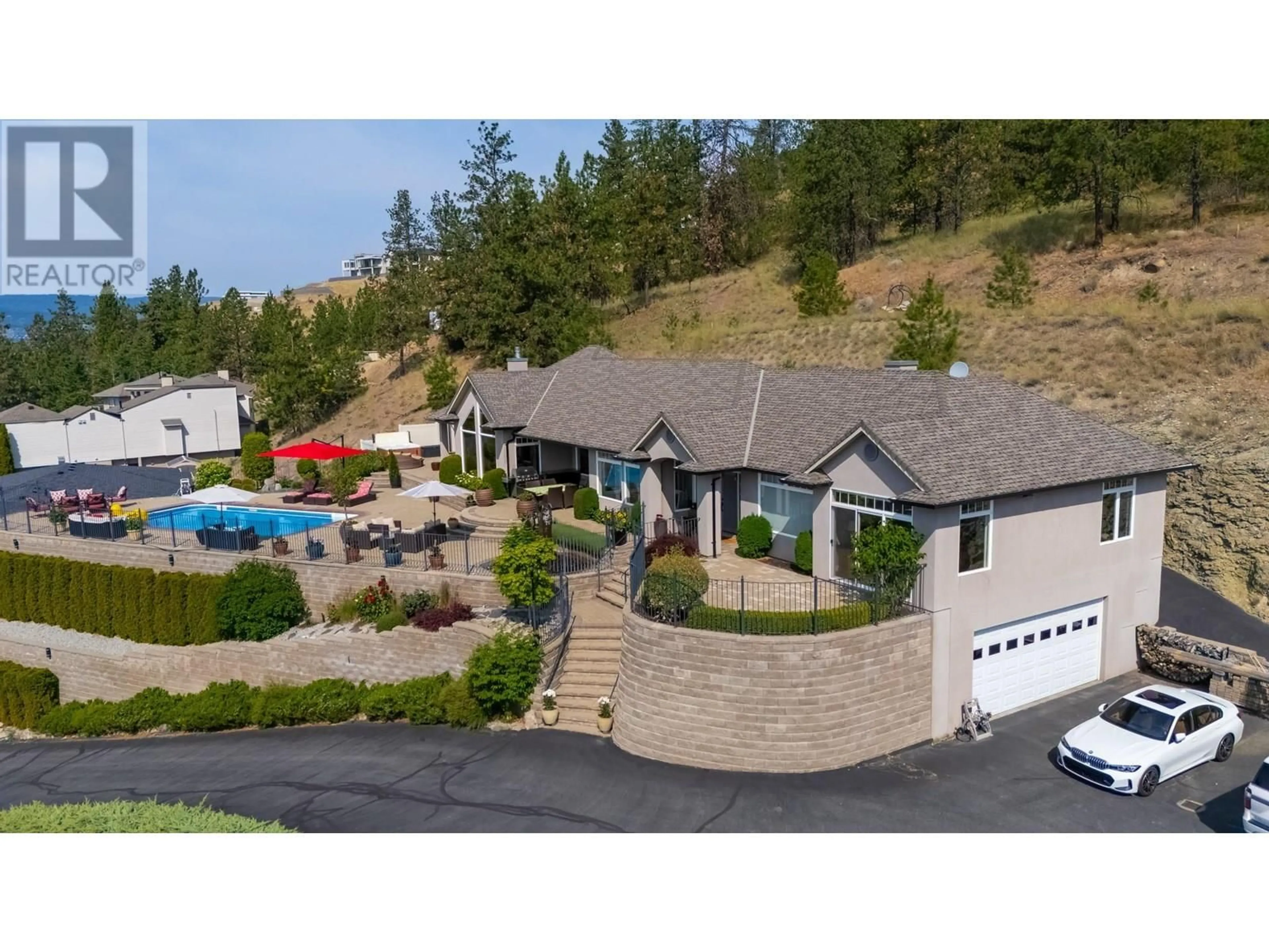 A pic from outside/outdoor area/front of a property/back of a property/a pic from drone, mountain view for 1260 TIMOTHY PLACE, Kelowna British Columbia V1Z3N2