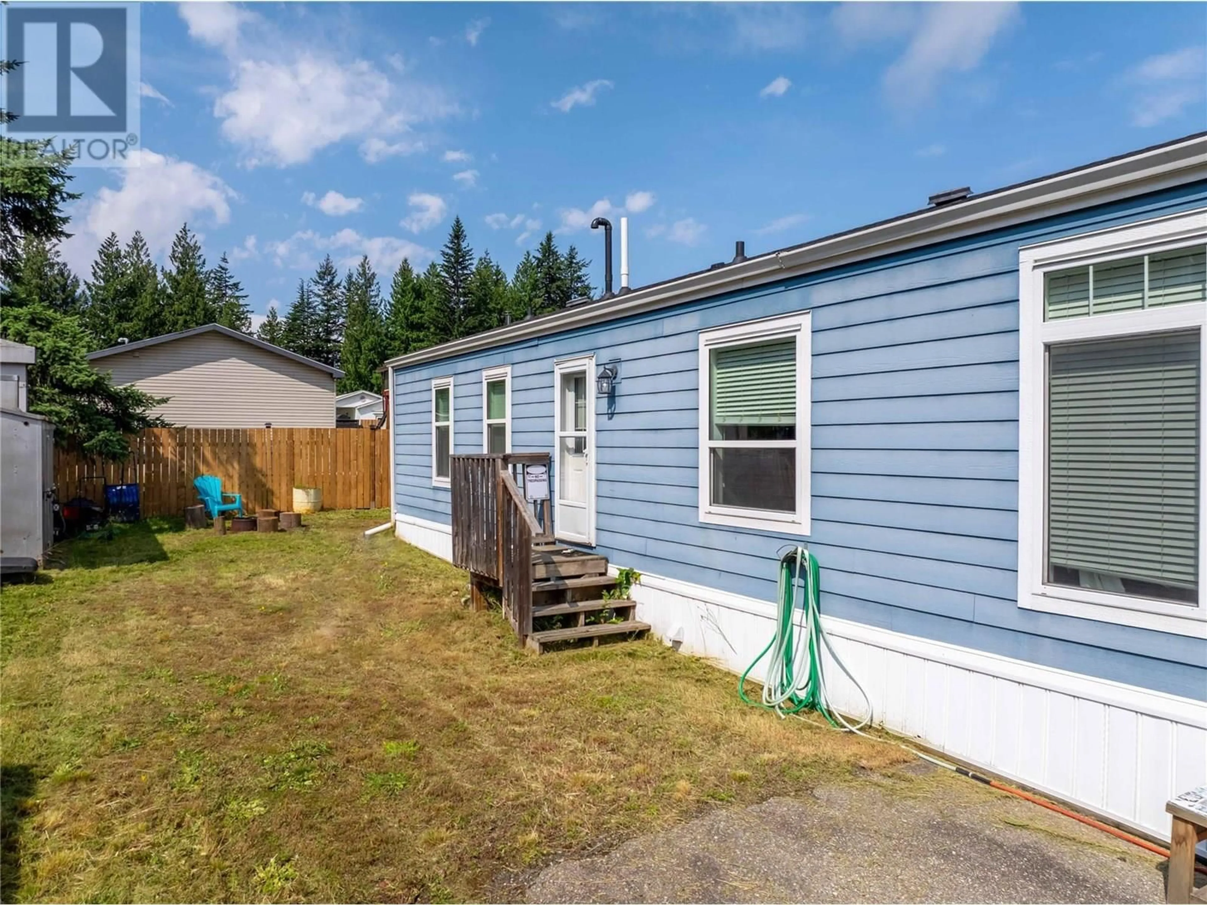 Home with vinyl exterior material, street for 38 JOHNSON WAY, Revelstoke British Columbia V0E2S1