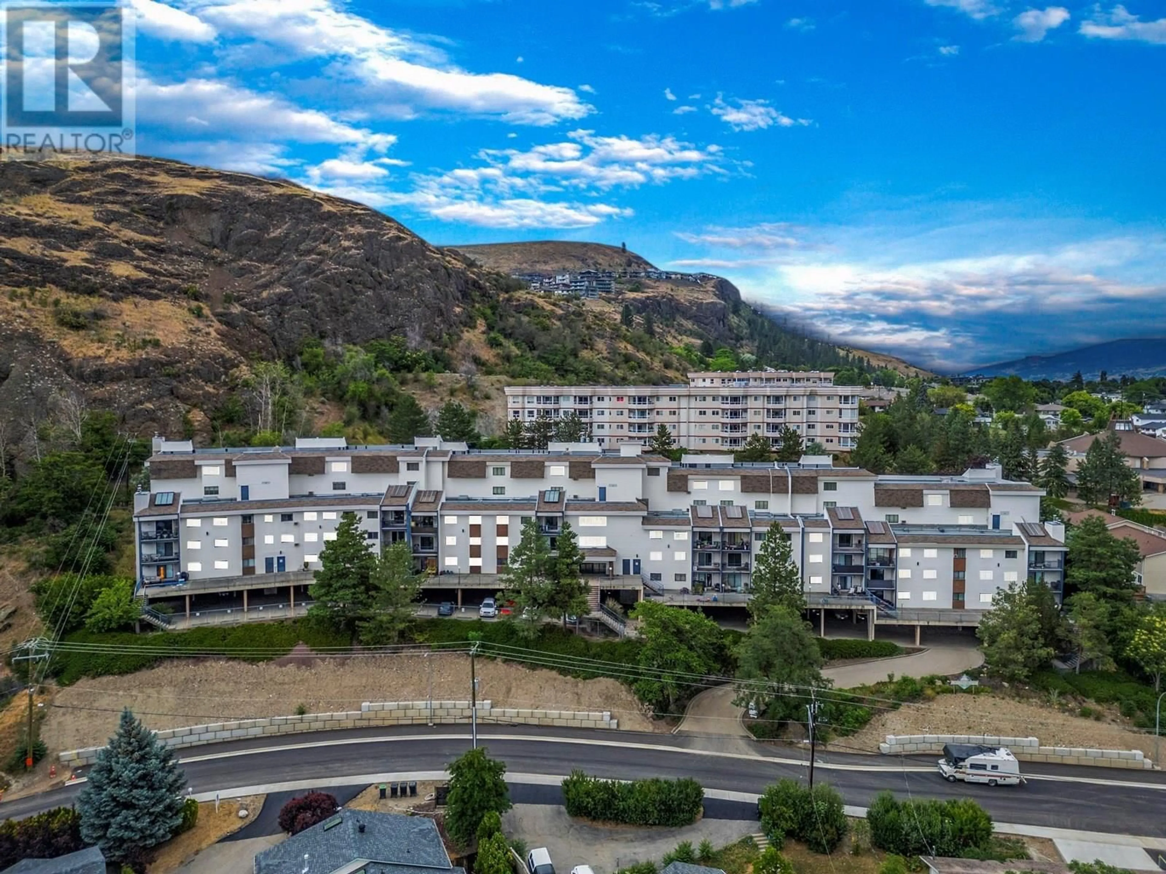 A pic from outside/outdoor area/front of a property/back of a property/a pic from drone, mountain view for 414 - 3901 32 AVENUE, Vernon British Columbia V1T8M3