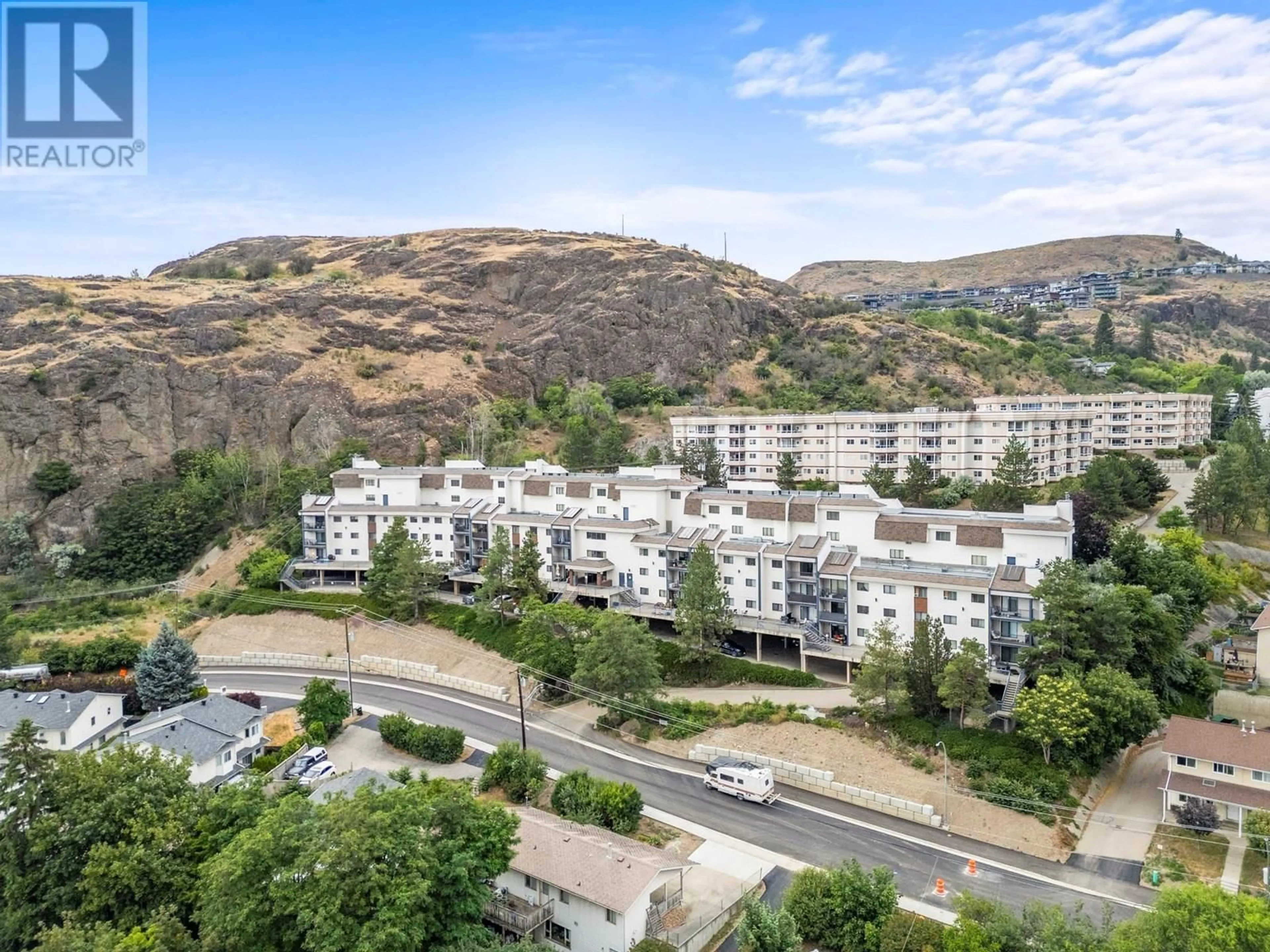 A pic from outside/outdoor area/front of a property/back of a property/a pic from drone, mountain view for 414 - 3901 32 AVENUE, Vernon British Columbia V1T8M3