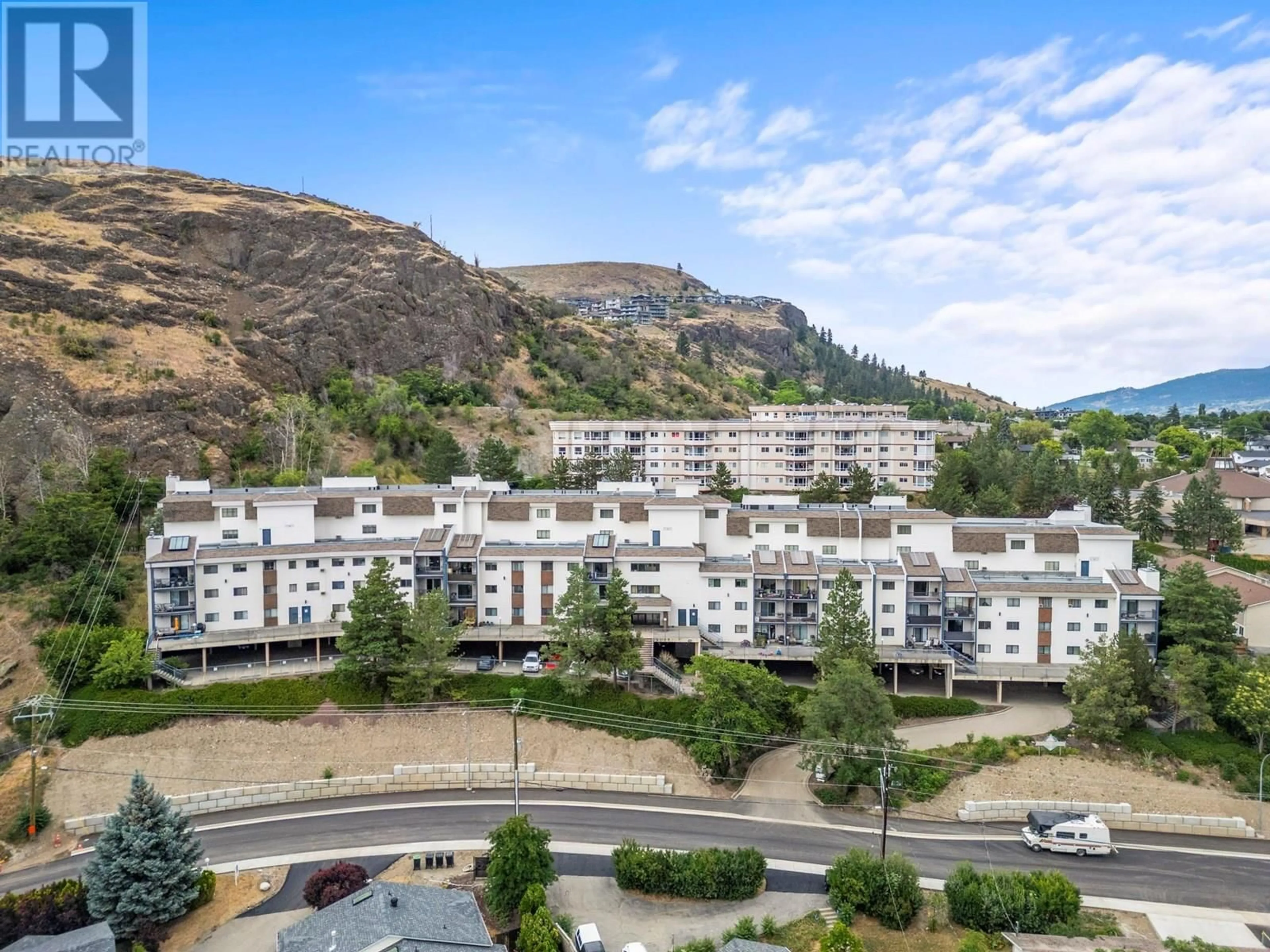 A pic from outside/outdoor area/front of a property/back of a property/a pic from drone, mountain view for 414 - 3901 32 AVENUE, Vernon British Columbia V1T8M3