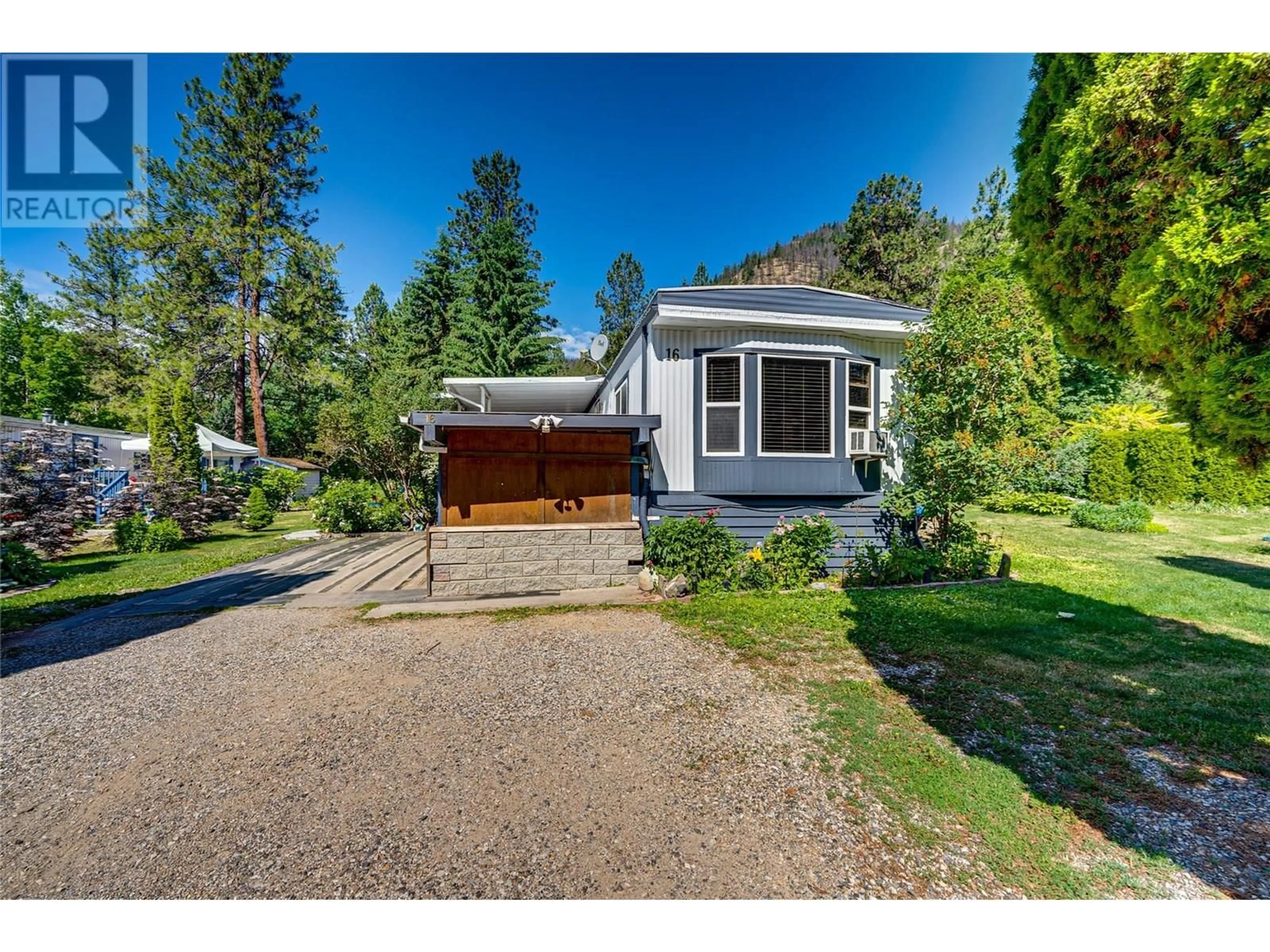 A pic from outside/outdoor area/front of a property/back of a property/a pic from drone, street for 16 - 12069 WESTSIDE ROAD, Vernon British Columbia V1H2A5
