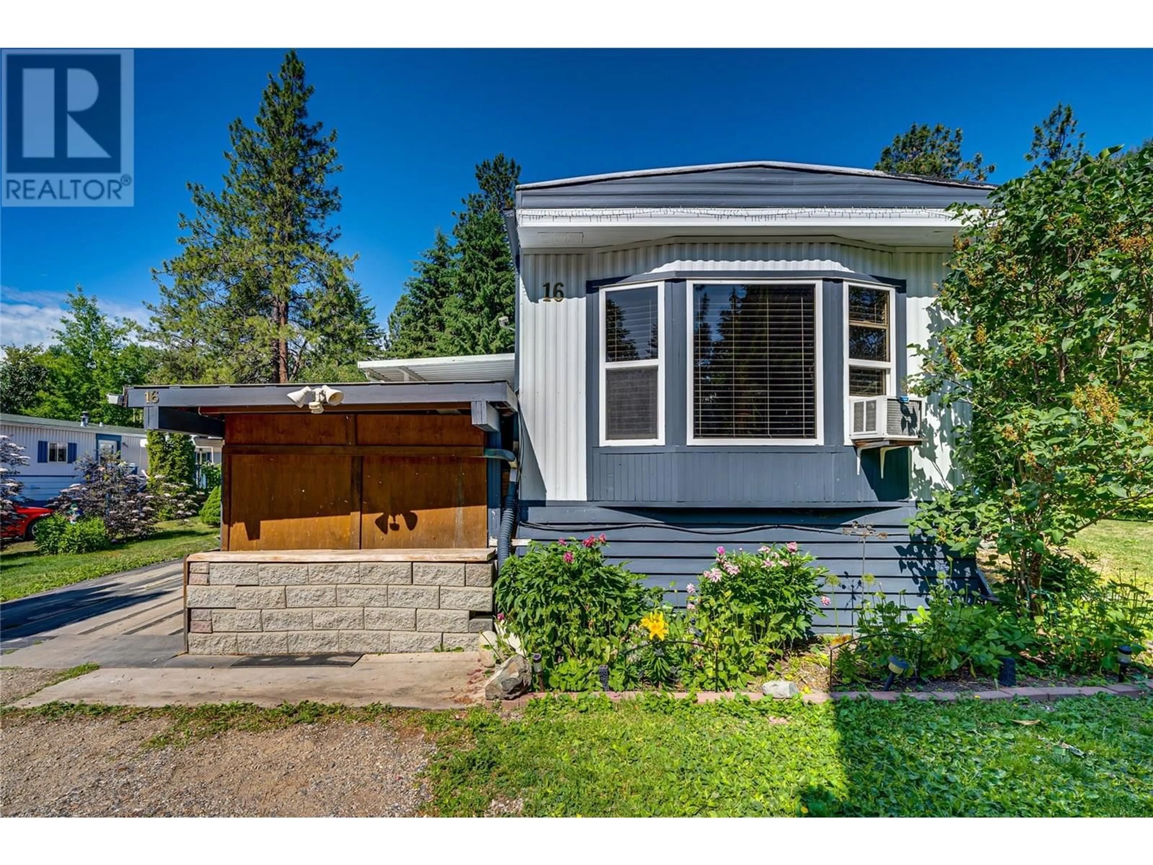 Home with vinyl exterior material, street for 16 - 12069 WESTSIDE ROAD, Vernon British Columbia V1H2A5