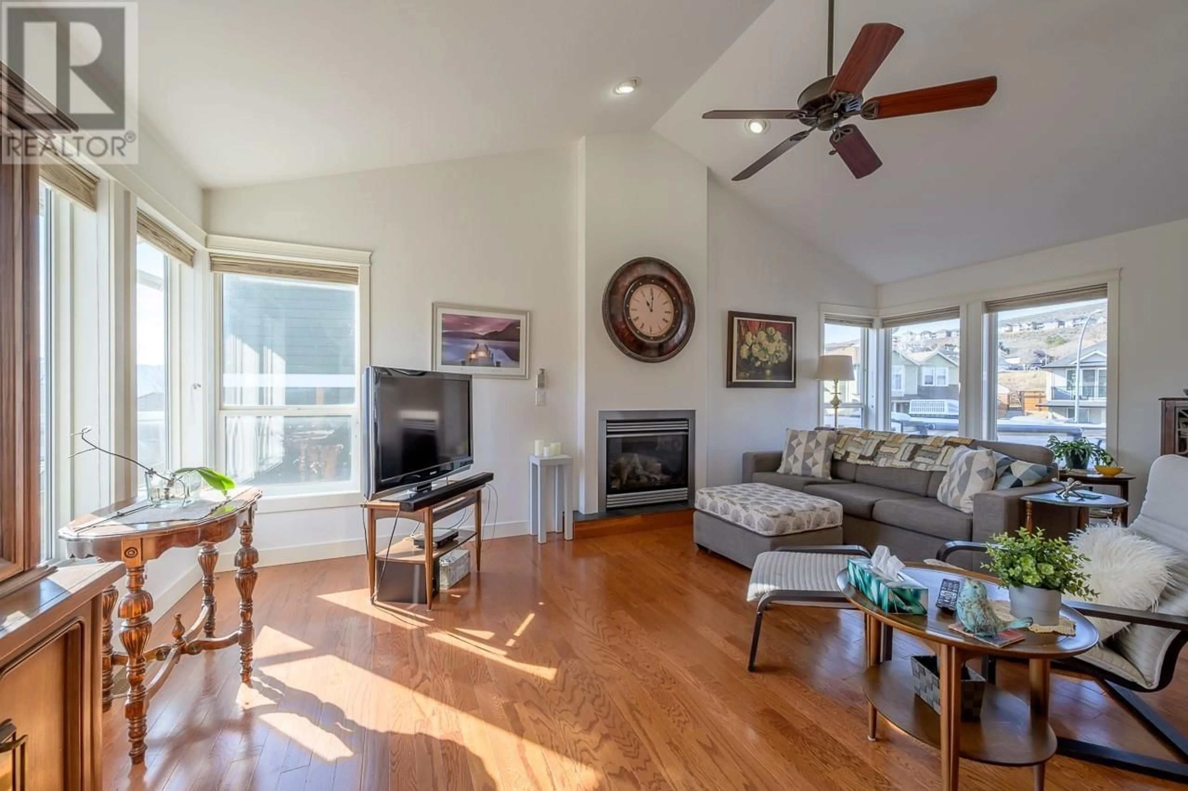 Living room with furniture, wood/laminate floor for 2150 CANTLE PLACE, Kamloops British Columbia V2B0A7