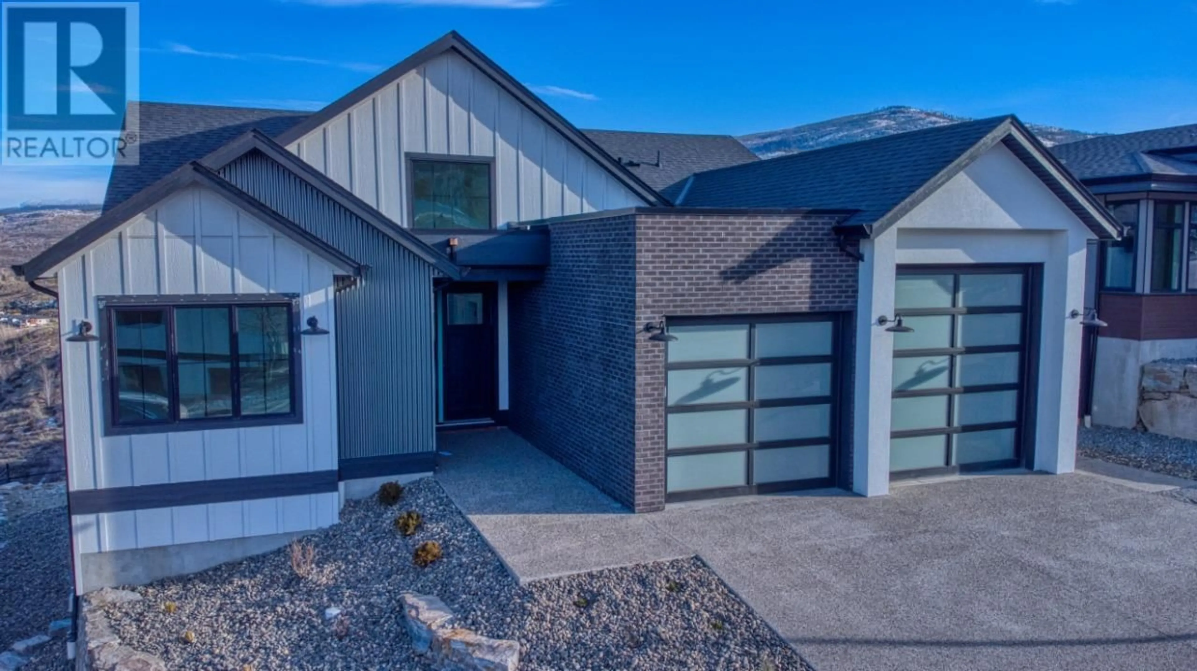 Home with brick exterior material, street for 1066 EMSLIE STREET, Kelowna British Columbia V1W0C3