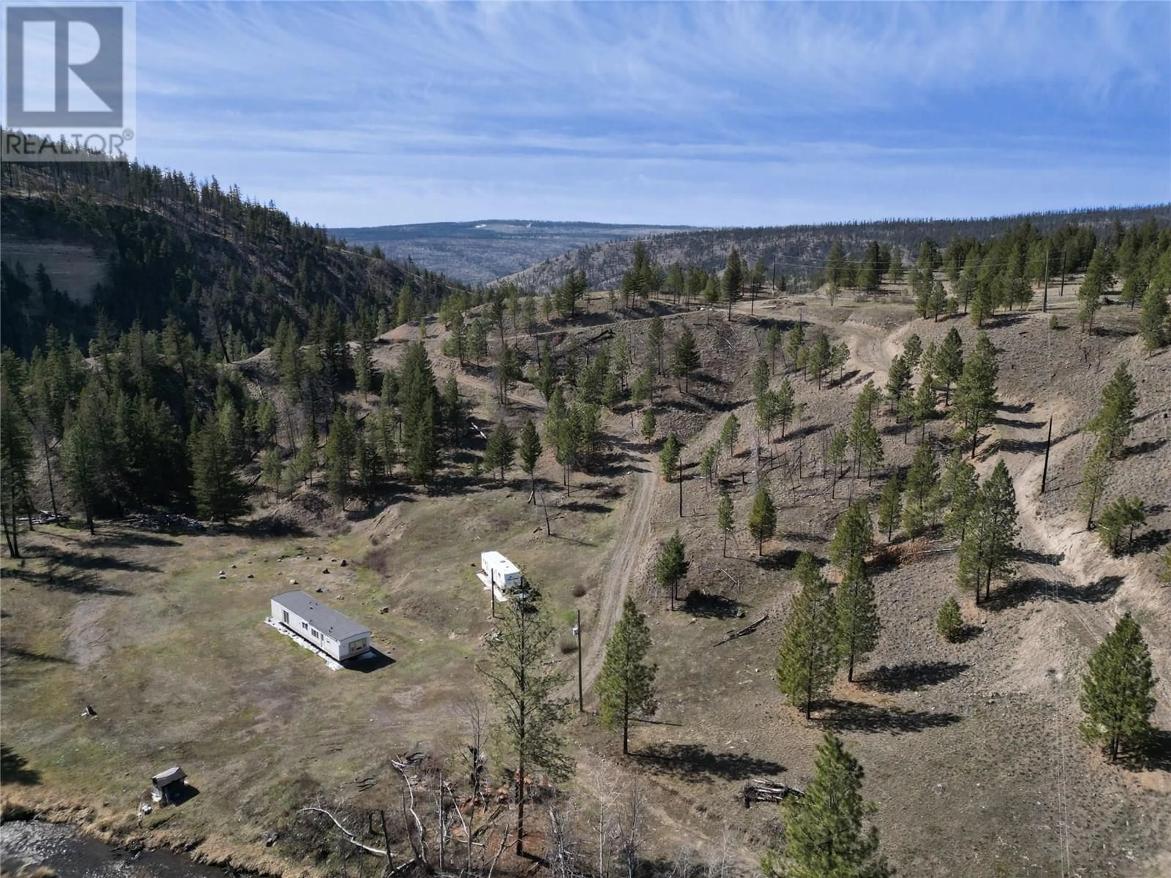 A pic from outside/outdoor area/front of a property/back of a property/a pic from drone, forest/trees view for 1280/1284 RENSCH ROAD, Loon Lake British Columbia V0K1H1