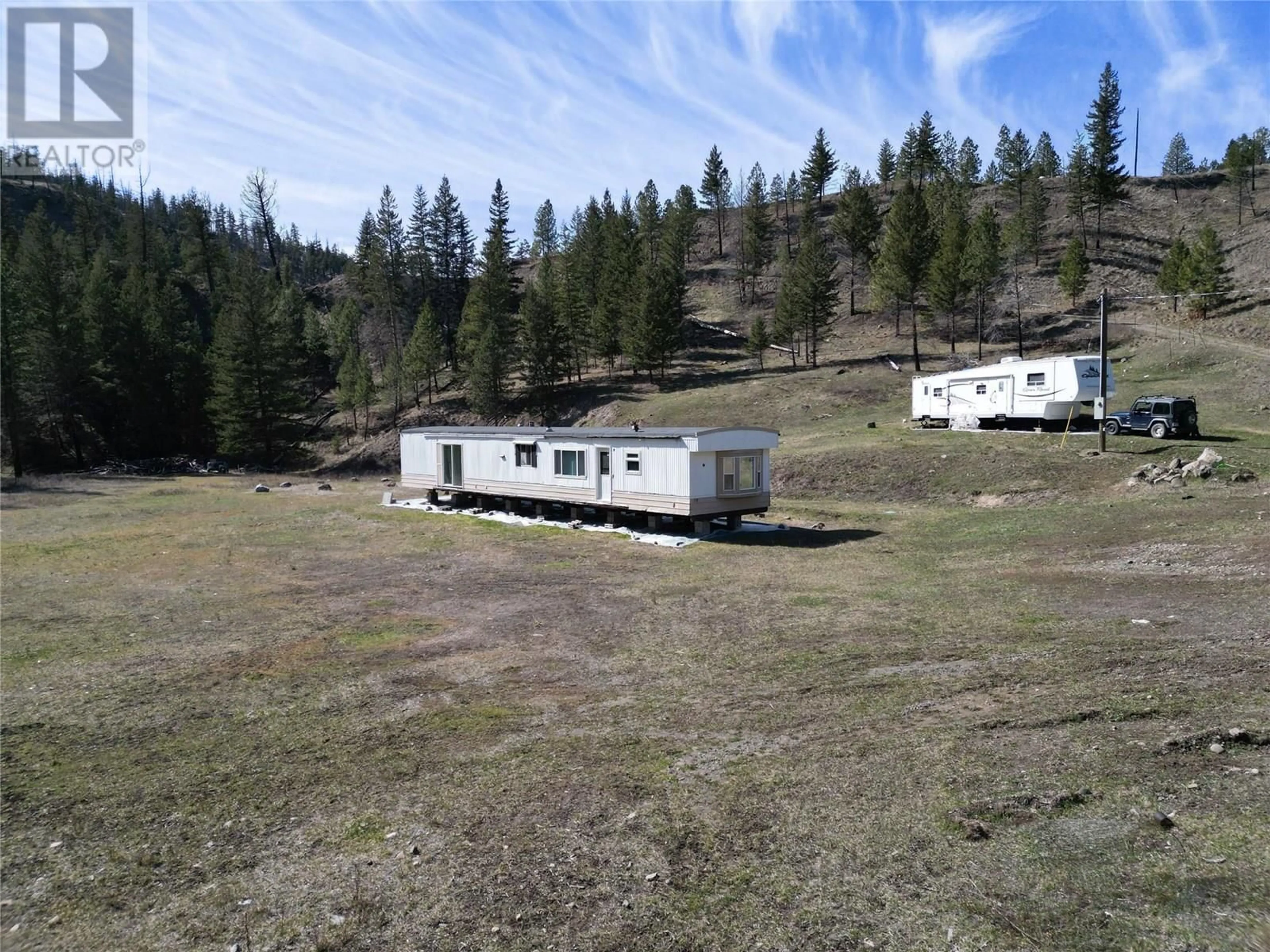 A pic from outside/outdoor area/front of a property/back of a property/a pic from drone, mountain view for 1280/1284 RENSCH ROAD, Loon Lake British Columbia V0K1H1