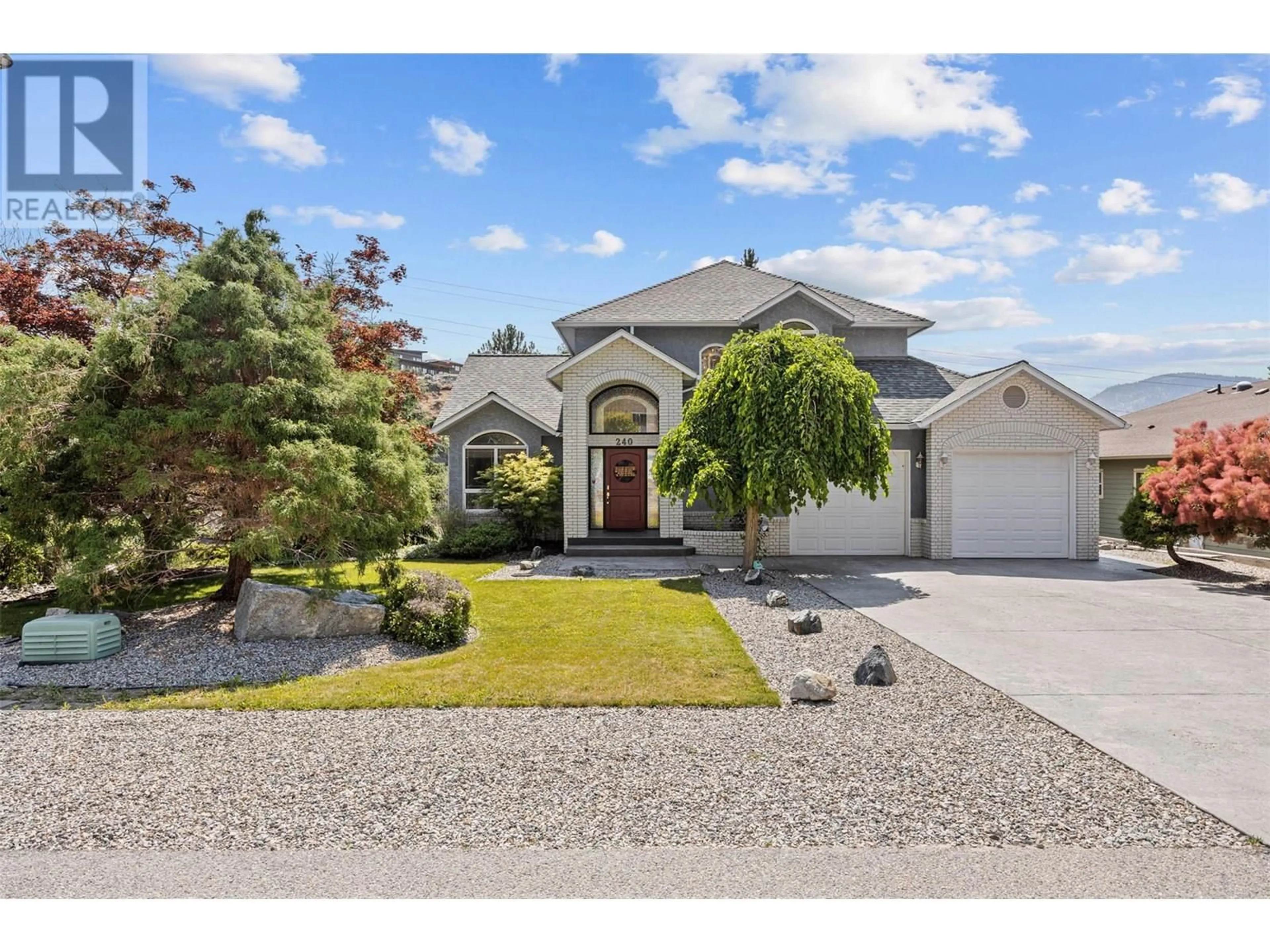 Home with vinyl exterior material, street for 240 HERITAGE BOULEVARD, Okanagan Falls British Columbia V0H1R3