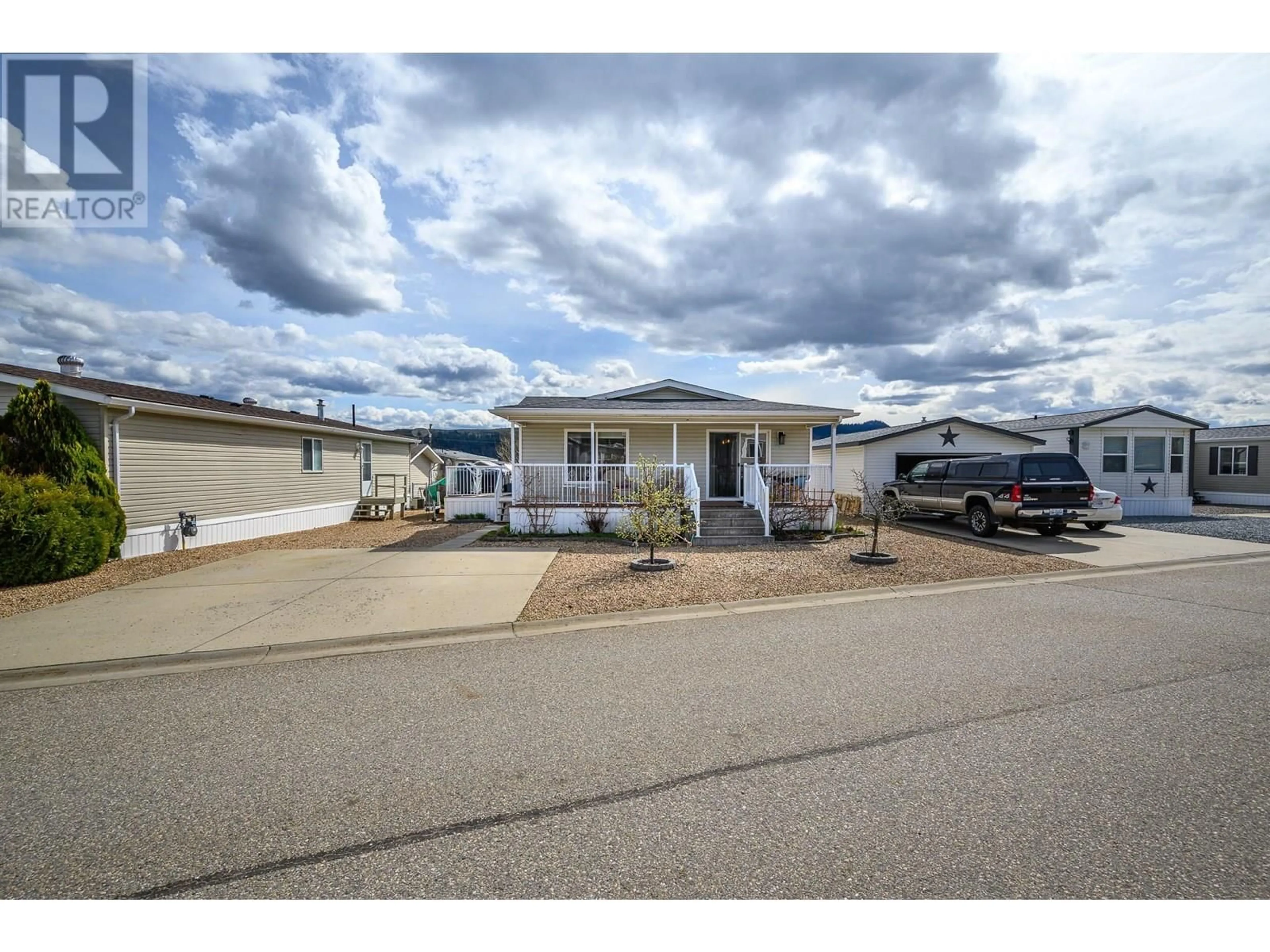 Home with vinyl exterior material, street for 21 - 12560 WESTSIDE ROAD, Vernon British Columbia V1H1S9