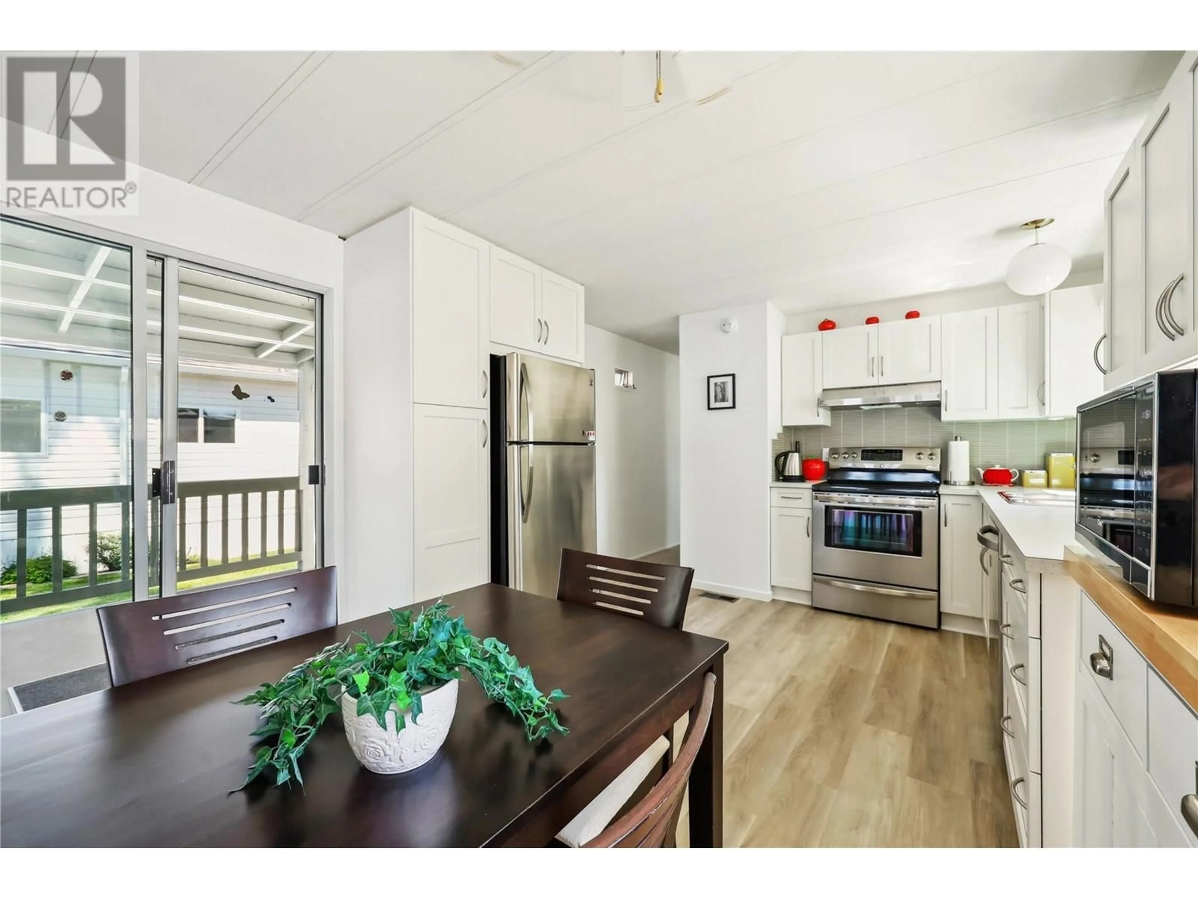 Open concept kitchen, wood/laminate floor for 33 - 2095 BOUCHERIE ROAD, Westbank British Columbia V4T2A7