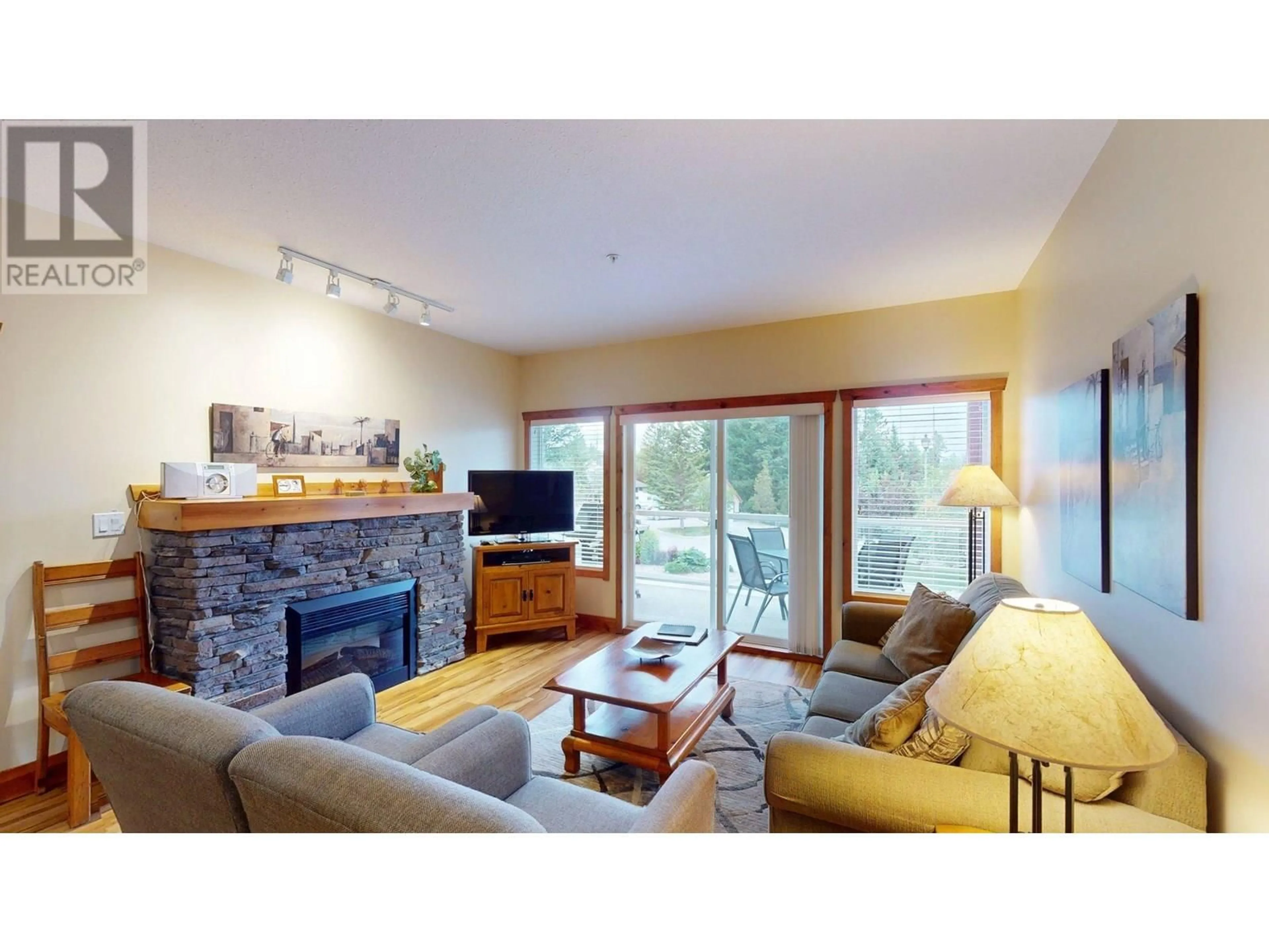 Living room with furniture, wood/laminate floor for 213 I - 701 14A CRESCENT, Invermere British Columbia V0A1K0