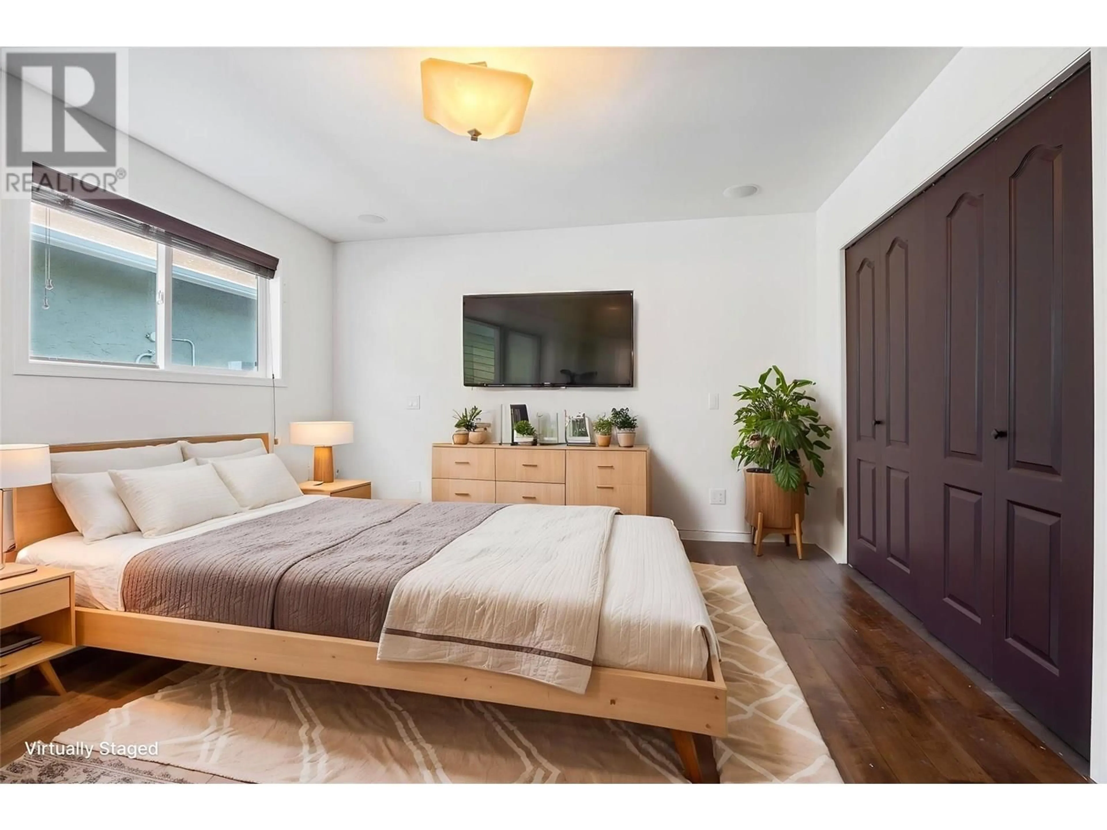 Bedroom with bed, wood/laminate floor for 250 ROY AVENUE, Penticton British Columbia V2A7X8