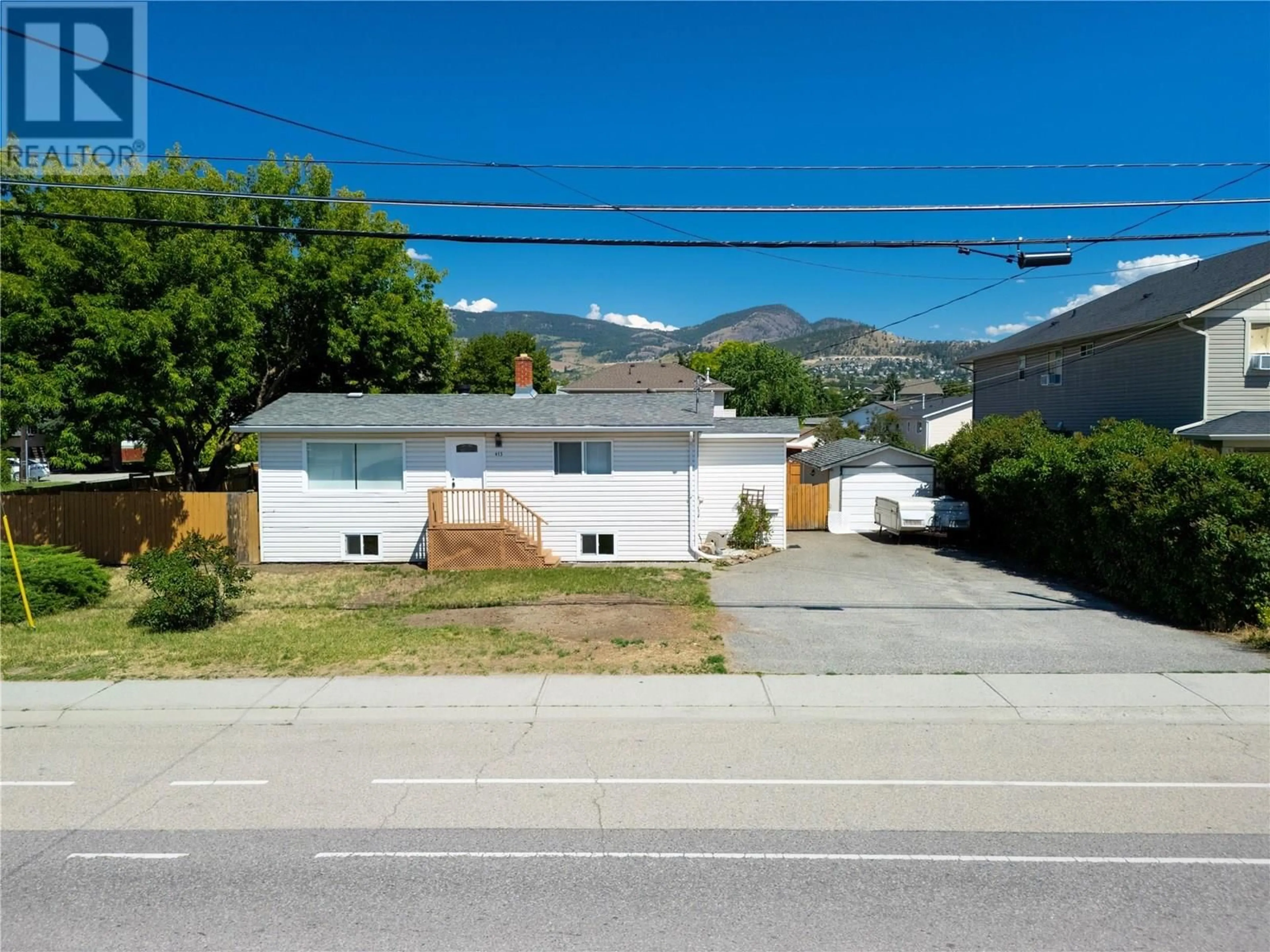 A pic from outside/outdoor area/front of a property/back of a property/a pic from drone, mountain view for 415 GERSTMAR ROAD, Kelowna British Columbia V1X4B2