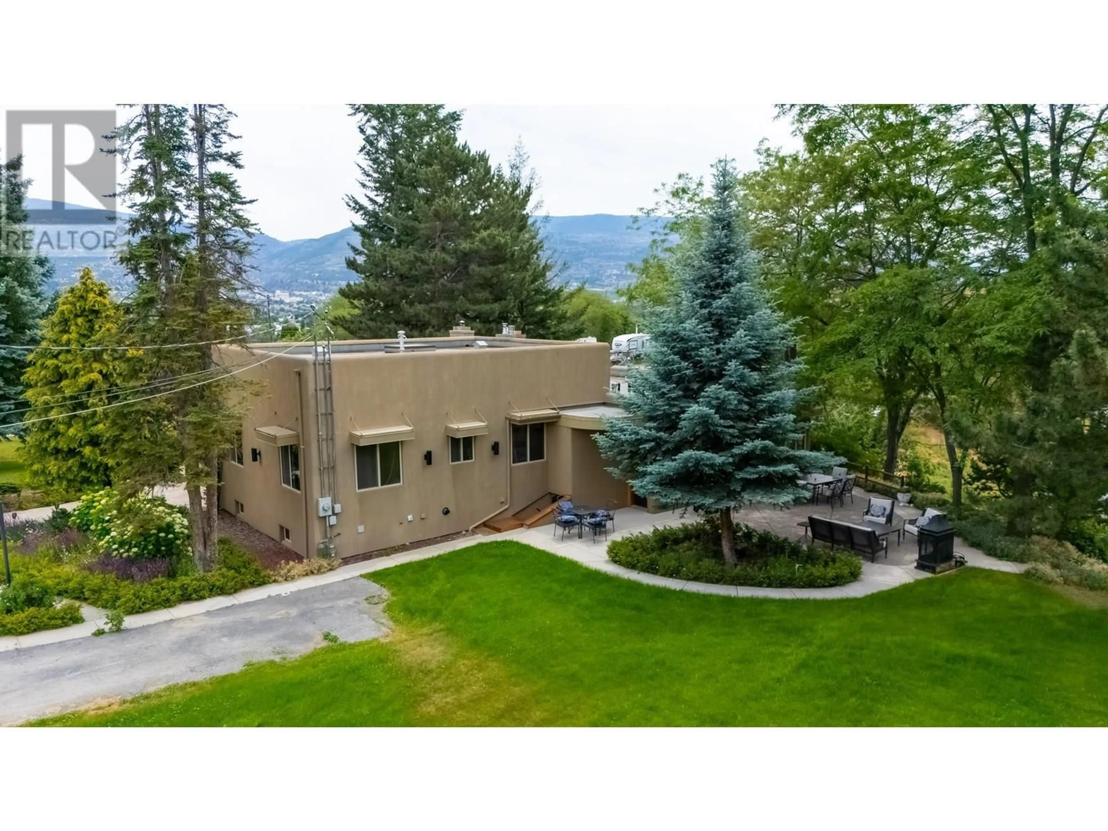 A pic from outside/outdoor area/front of a property/back of a property/a pic from drone, mountain view for 119 SUNGLO DRIVE, Penticton British Columbia V2A8X6
