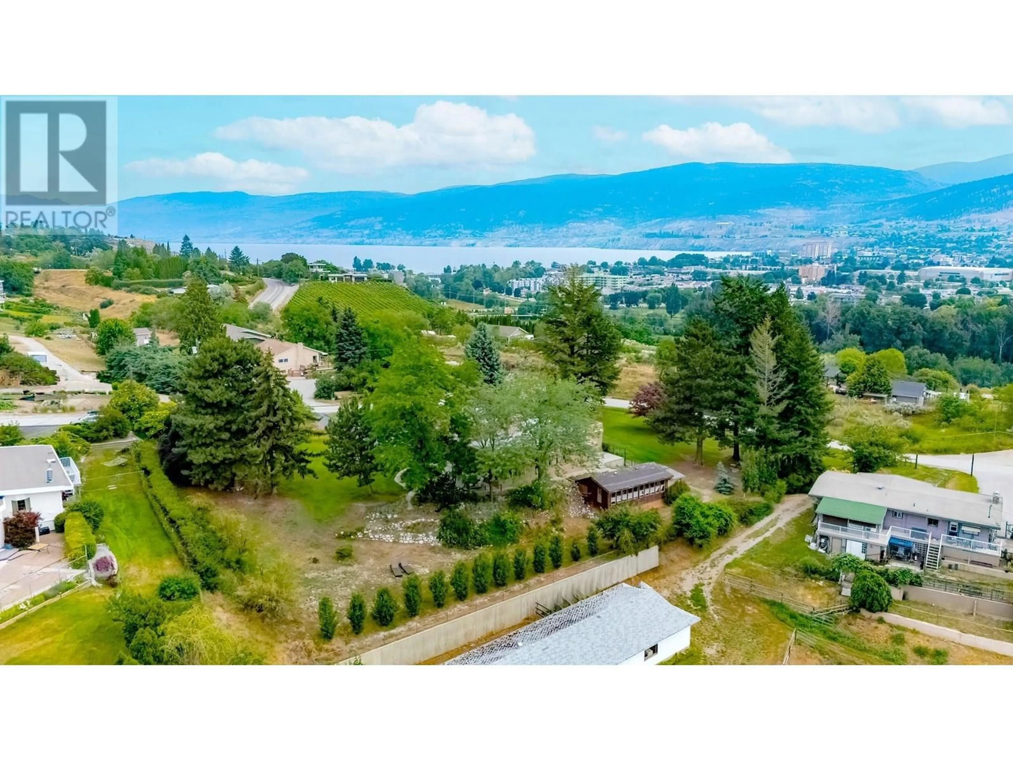 A pic from outside/outdoor area/front of a property/back of a property/a pic from drone, mountain view for 119 SUNGLO DRIVE, Penticton British Columbia V2A8X6