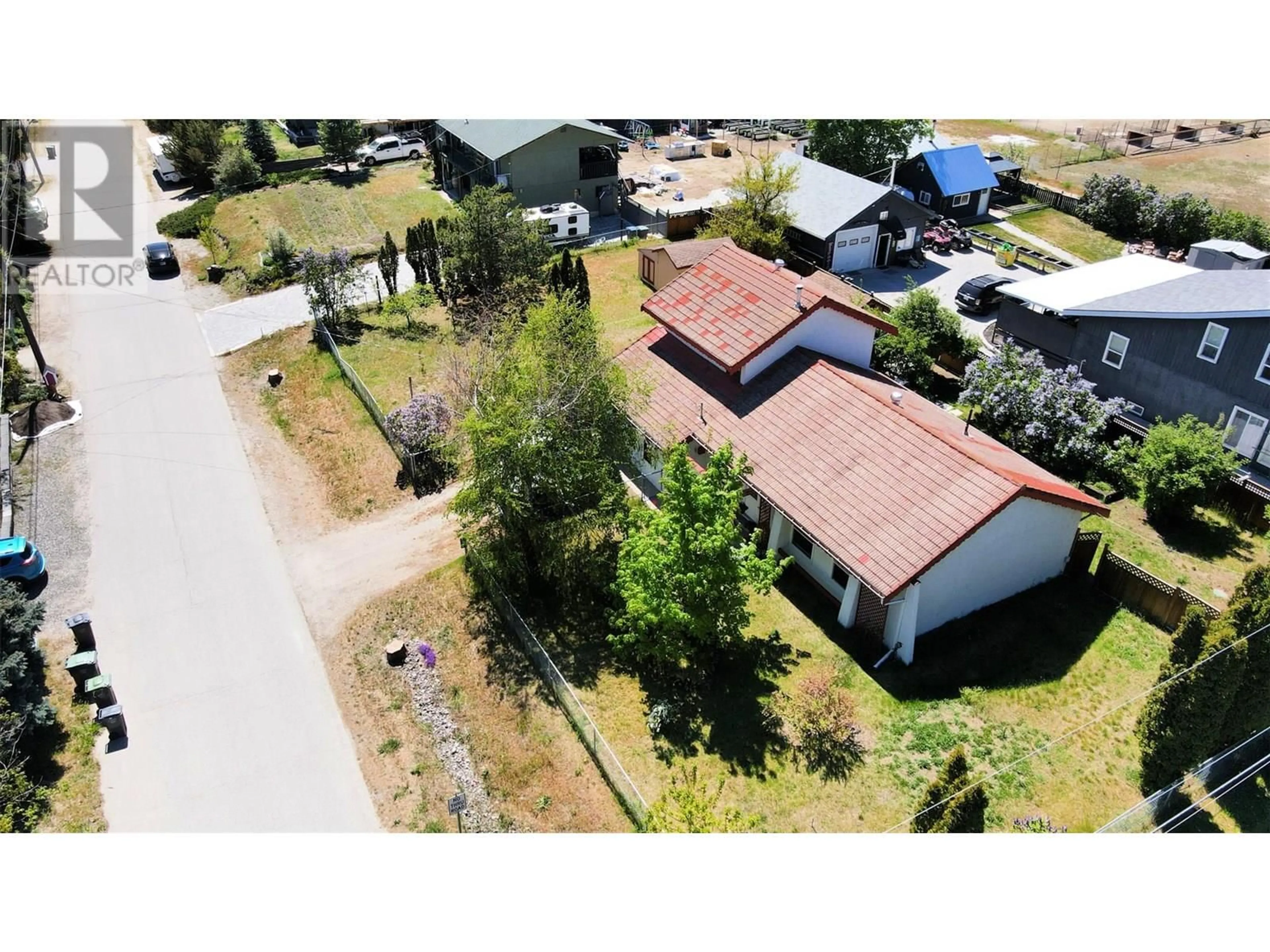 A pic from outside/outdoor area/front of a property/back of a property/a pic from drone, street for 6422 MACK ROAD, Peachland British Columbia V0H1X8