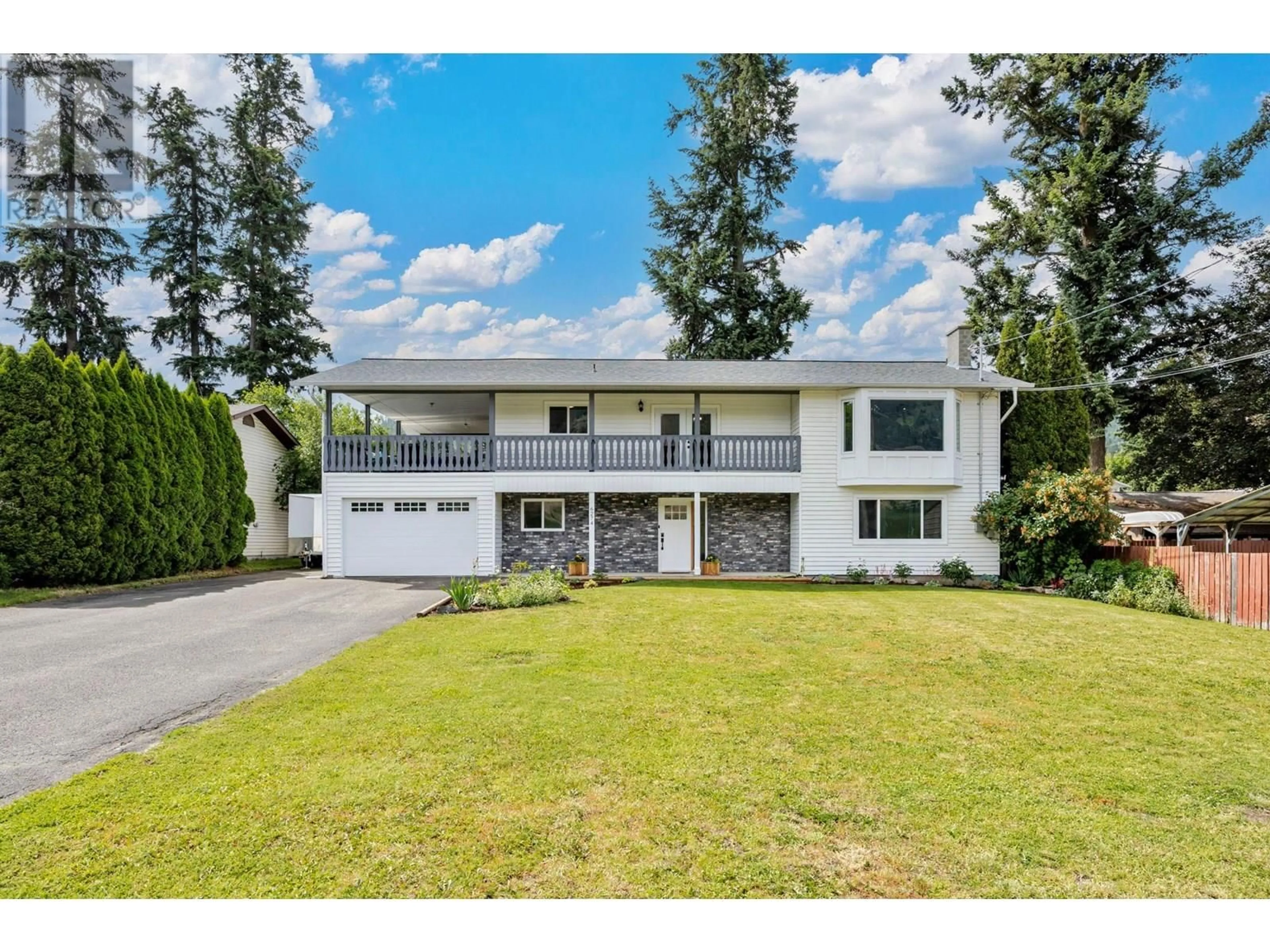 Home with vinyl exterior material, street for 6274 LEARMOUTH ROAD, Coldstream British Columbia V1B3G1