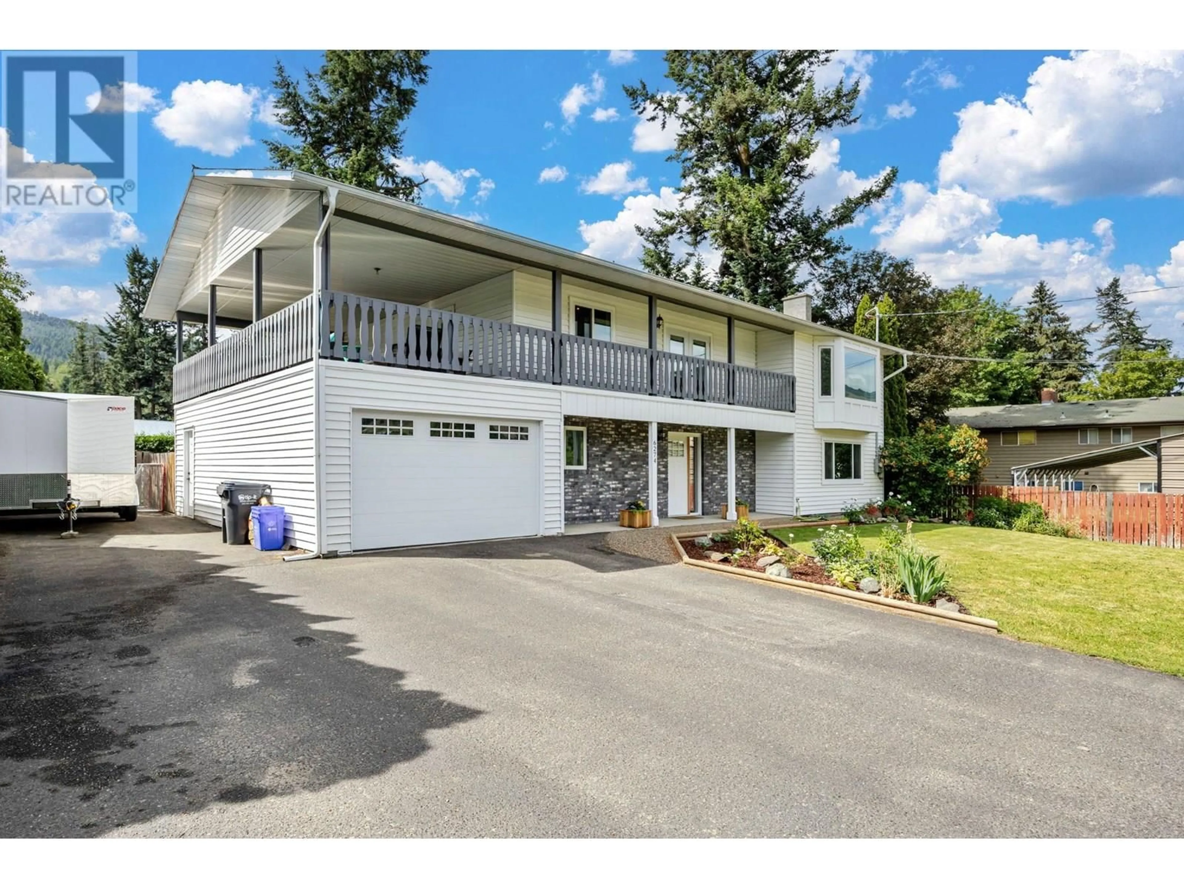 Home with vinyl exterior material, street for 6274 LEARMOUTH ROAD, Coldstream British Columbia V1B3G1