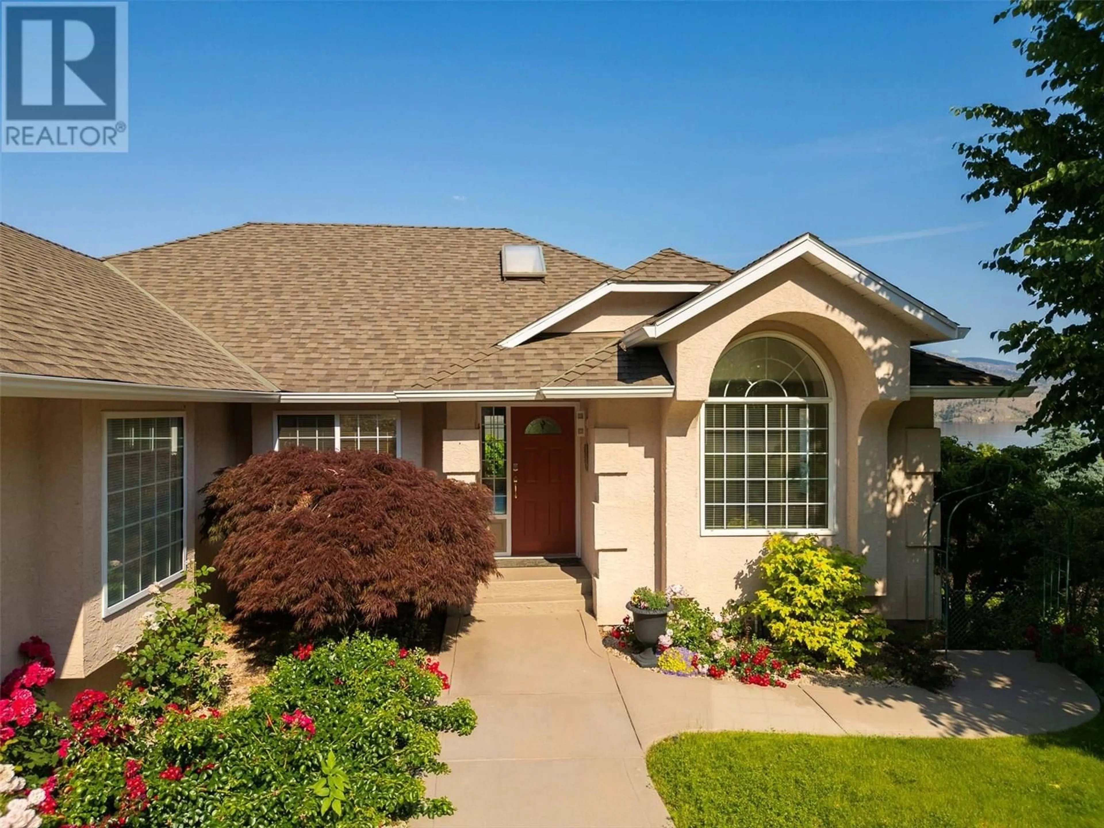 Home with vinyl exterior material, street for 6537 SHERBURN ROAD, Peachland British Columbia V0H1X7