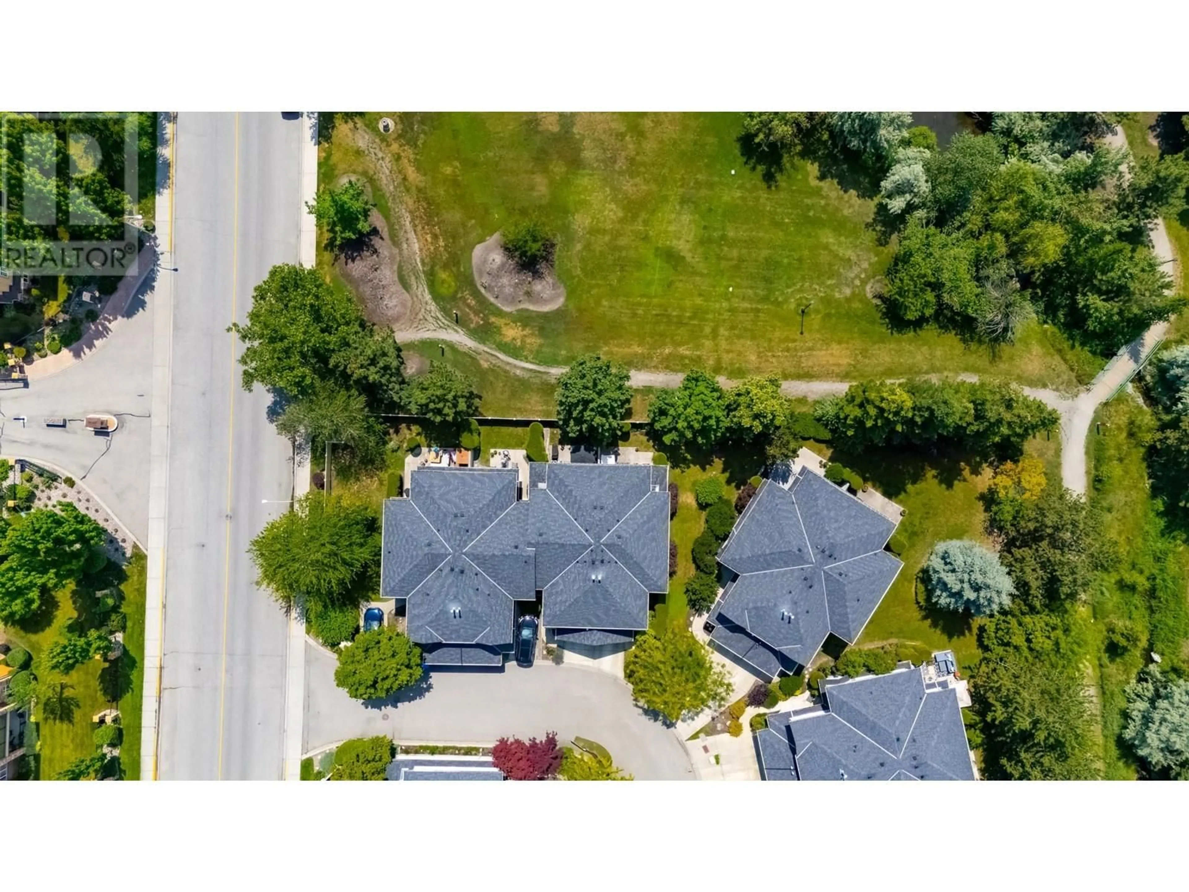 A pic from outside/outdoor area/front of a property/back of a property/a pic from drone, street for 4 - 316 WHITMAN ROAD, Kelowna British Columbia V1V1Y9